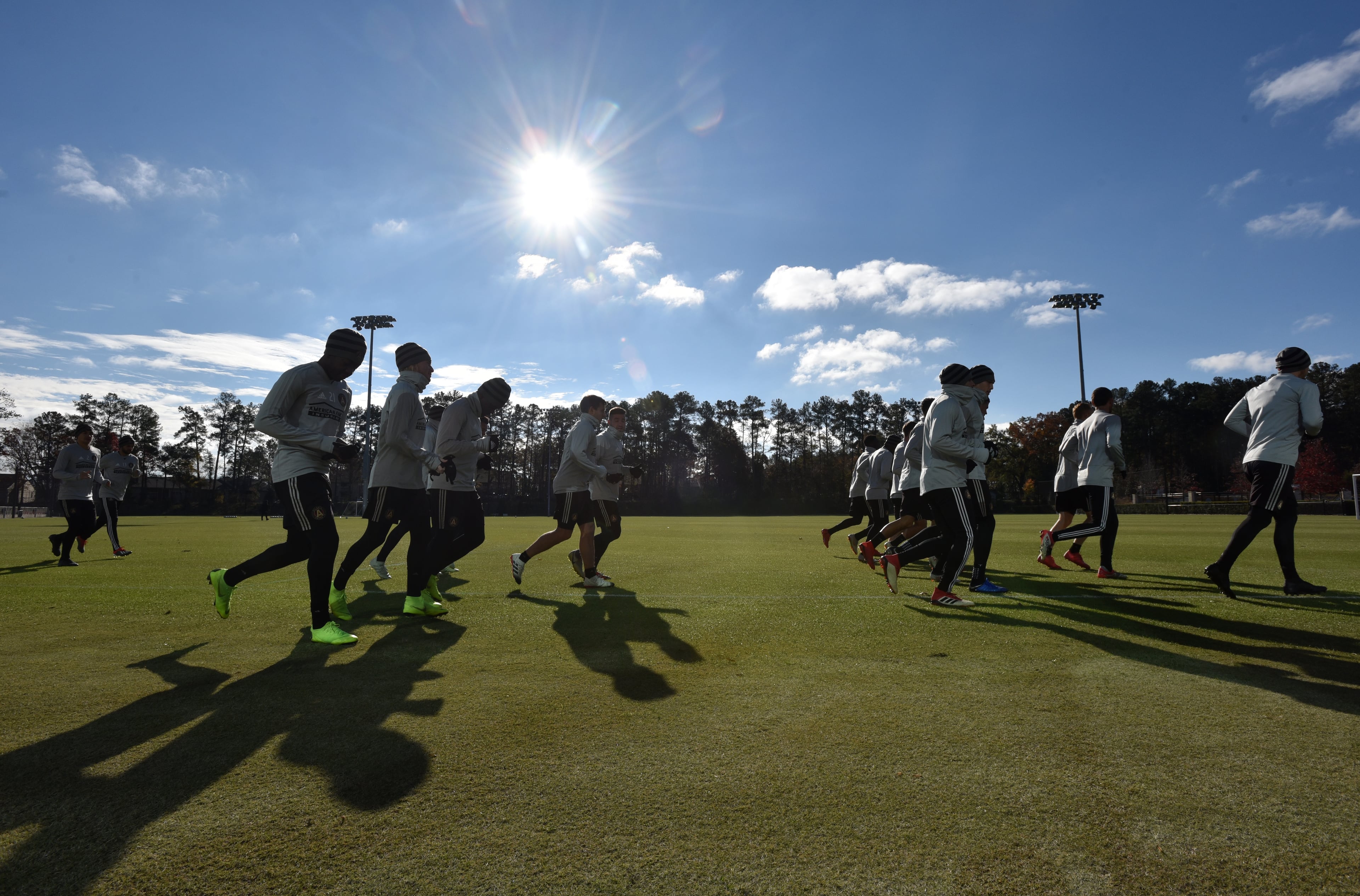 Atlanta United players warm up on a cool, sunny Tuesday morning as practice continues for Saturday's MLS Cup against the Portland Timbers at Mercedes-Benz Stadium. (Hyosub Shin/hshin@ajc.com)