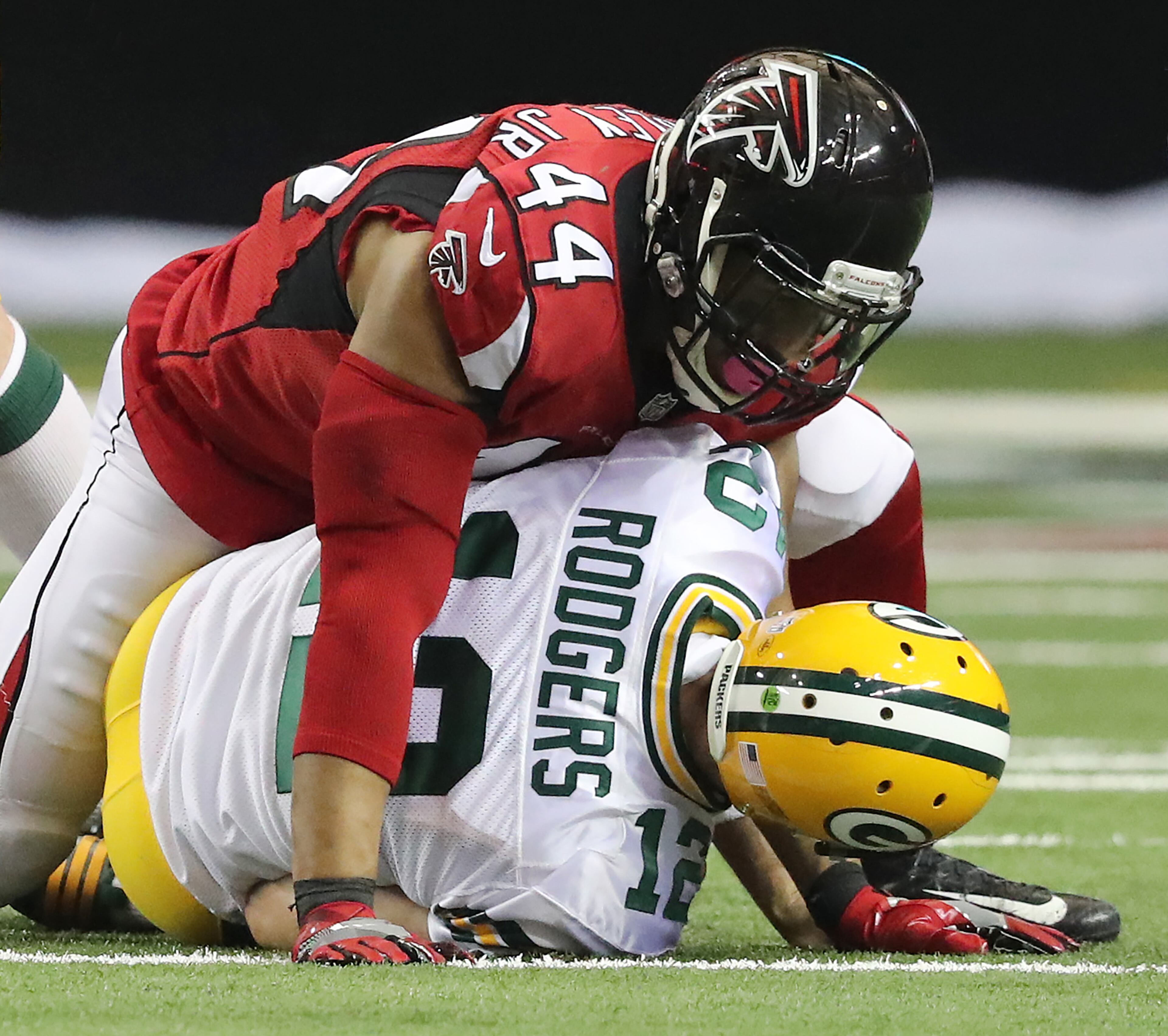 The Falcons' Vic Beasley Jr. sacks Packers quarterback Aaron Rodgers during the second quarter of Sunday's game at the Georgia Dome. Curtis Compton /ccompton@ajc.com