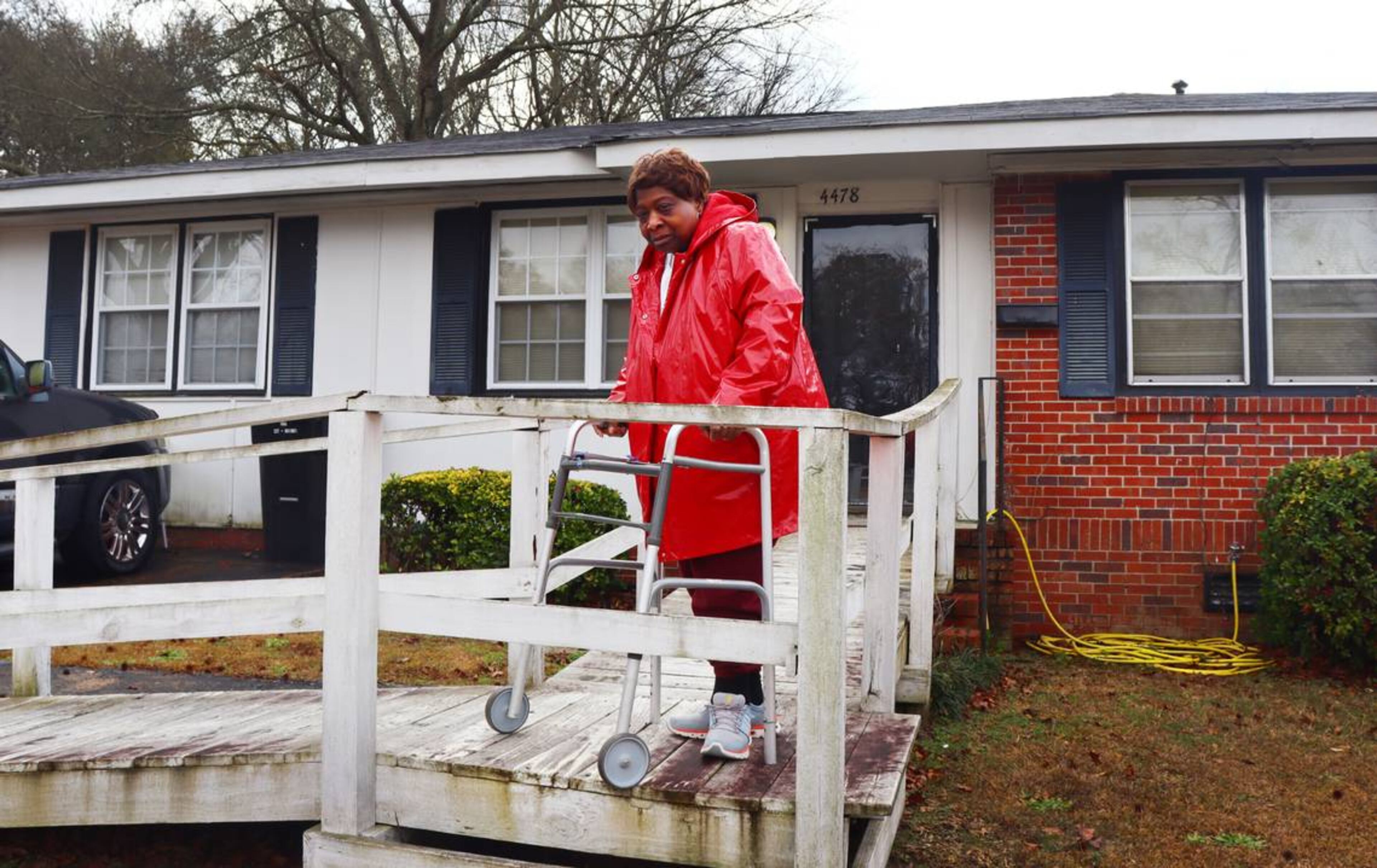 Vivian Nelson,70, stands in front of her house in Columbus, Georgia. Nelson’s broken A/C and heater were fixed for free through the weatherization program in early January. (Photo Courtesy of Kala Hunter)