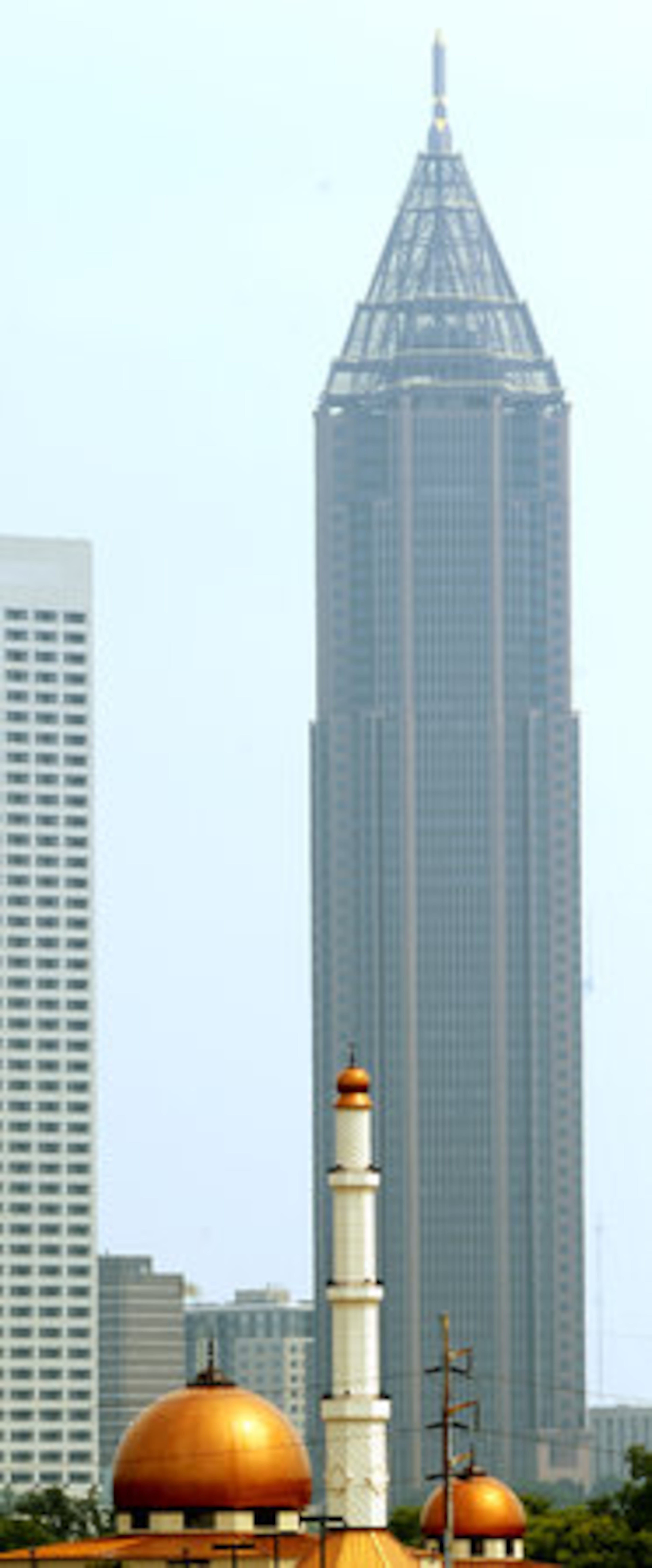 Al-Farooq mosque's minaret, the tall slender tower with a balcony from which a muezzin calls Muslims to prayer, rises 146 feet. The Bank of America is 1,023 feet tall.