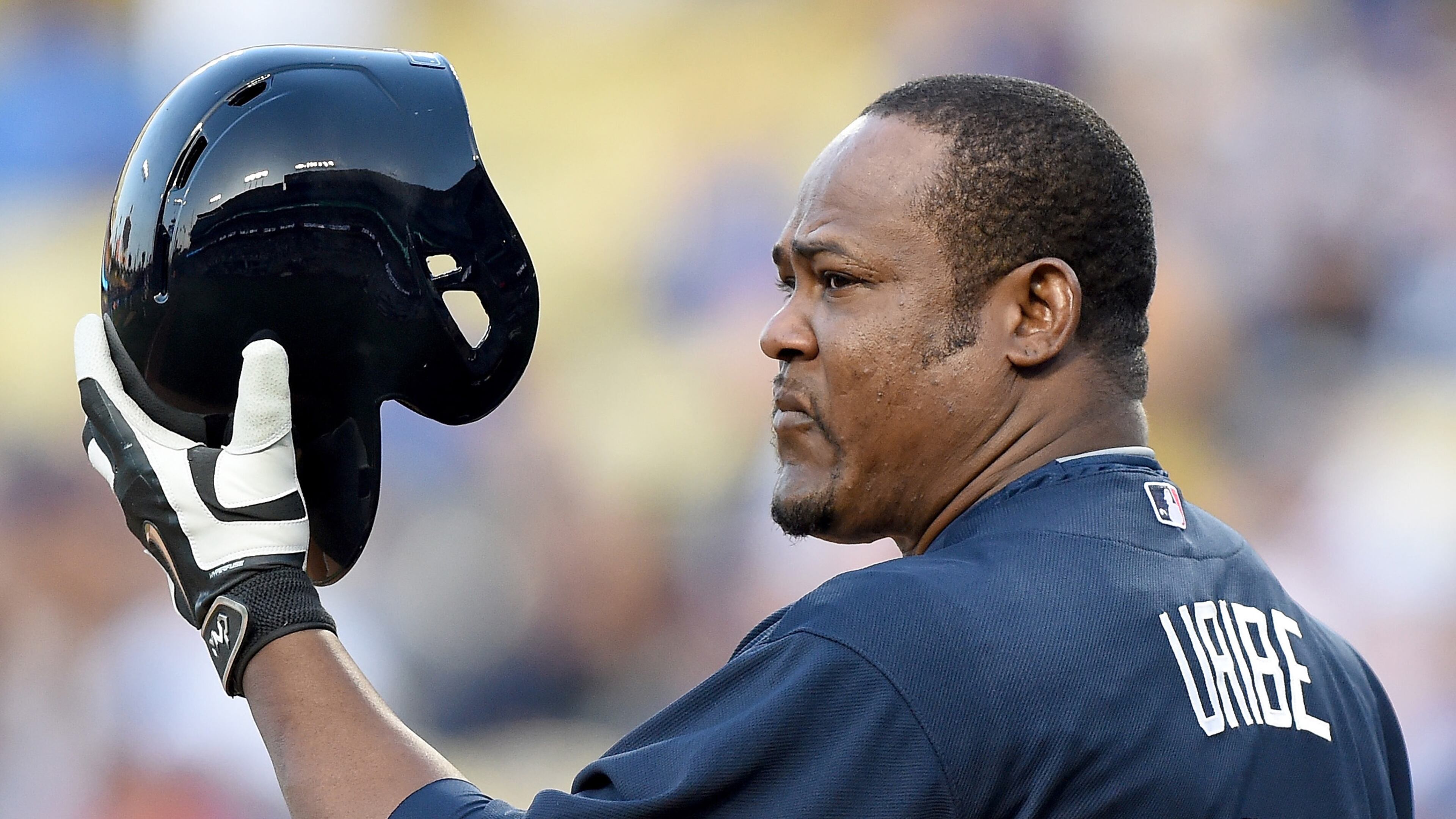 LOS ANGELES, CA - MAY 27: Juan Uribe #5 of the Atlanta Braves acknowledges the applause from Los Angeles Dodgers fans after a trade earlier in the day sent him to the Braves for Alberto Callaspo during the first inning at Dodger Stadium on May 27, 2015 in Los Angeles, California. (Photo by Harry How/Getty Images)