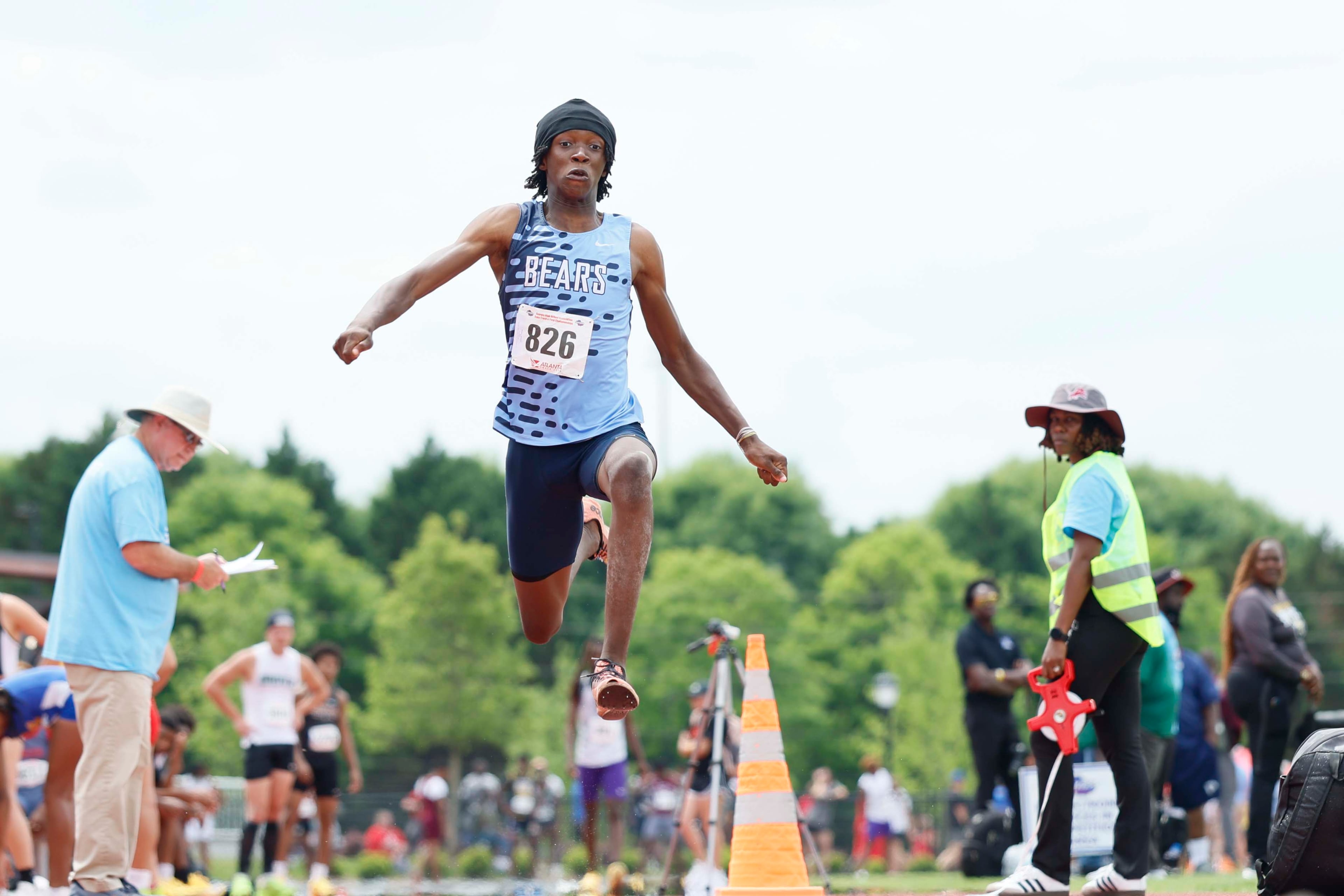 A Cambridge High School athlete participates in the Boys Long Jump AAAA at the GHSA track and field state championship at UGA Spec Towns Track on Monday, May 11, 2026, in Athens. (Miguel Martinez/AJC)