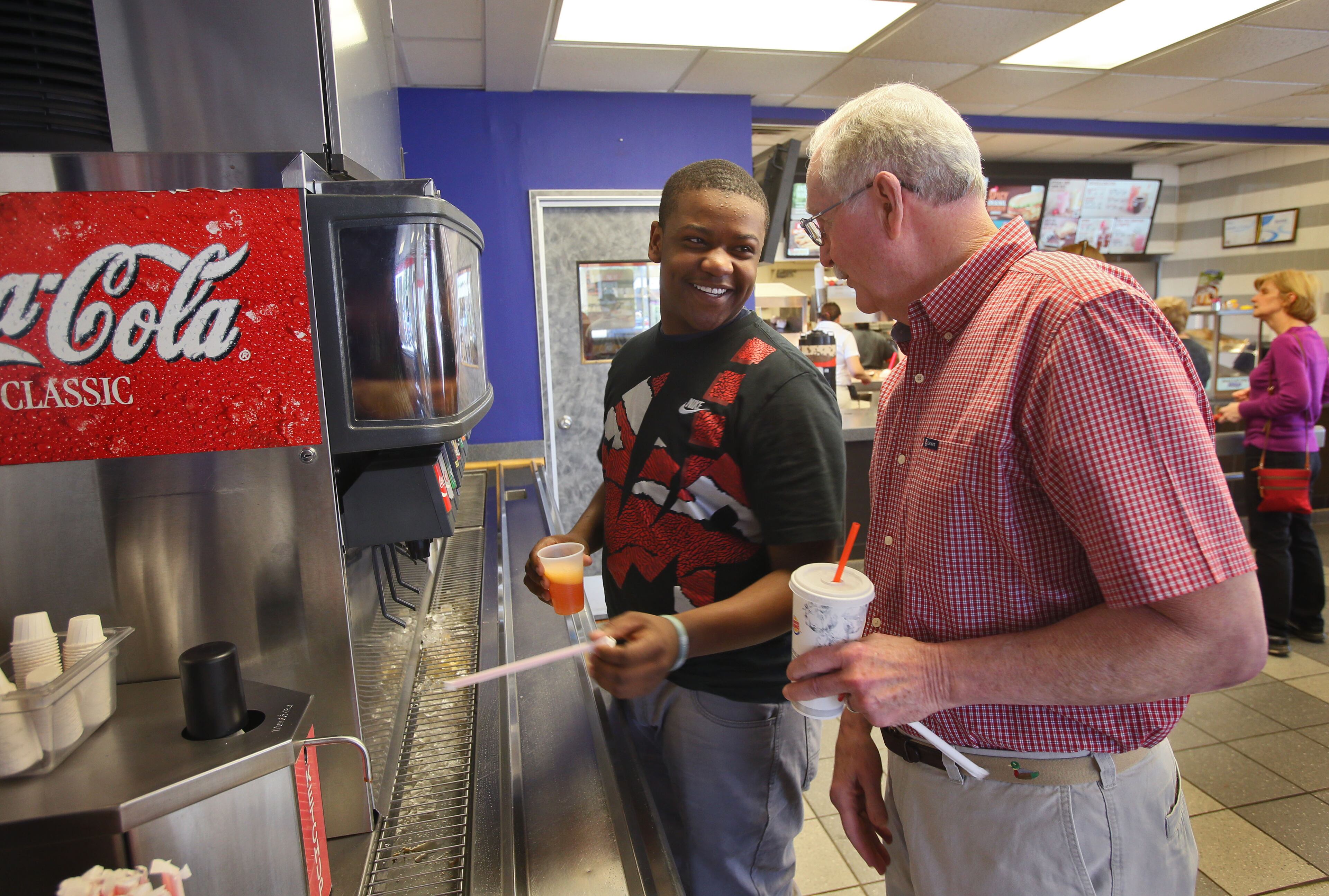 Mr. Collins eats lunch with Ashton on a recent Monday, just like he has for several years. Over time, these weekly get-togethers have changed Ashton’s life. BOB ANDRES / BANDRES@AJC.COM