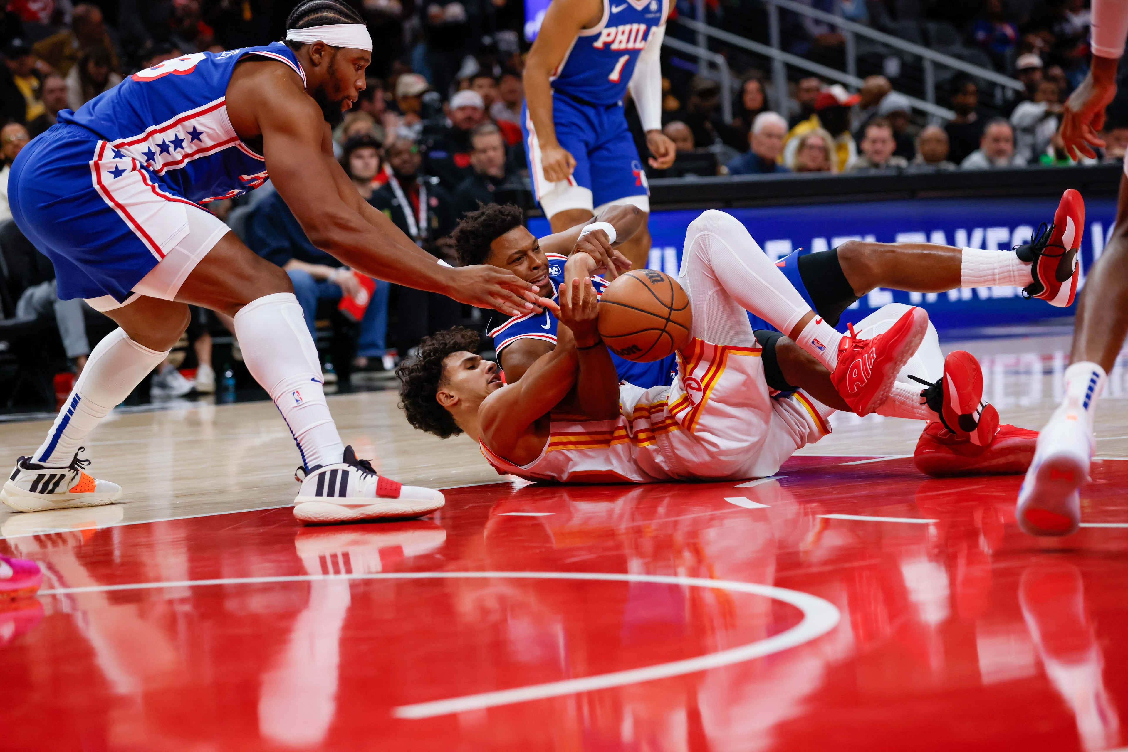 Atlanta Hawks forward Zaccharie Risacher (10) battles for possession against Philadelphia 76ers guard Kyle Lowry (7) during the first half against the Philadelphia 76rs at State Farm Arena during an NBA exhibition game on Monday, October 14, 2024, in Atlanta.
(Miguel Martinez/ AJC)