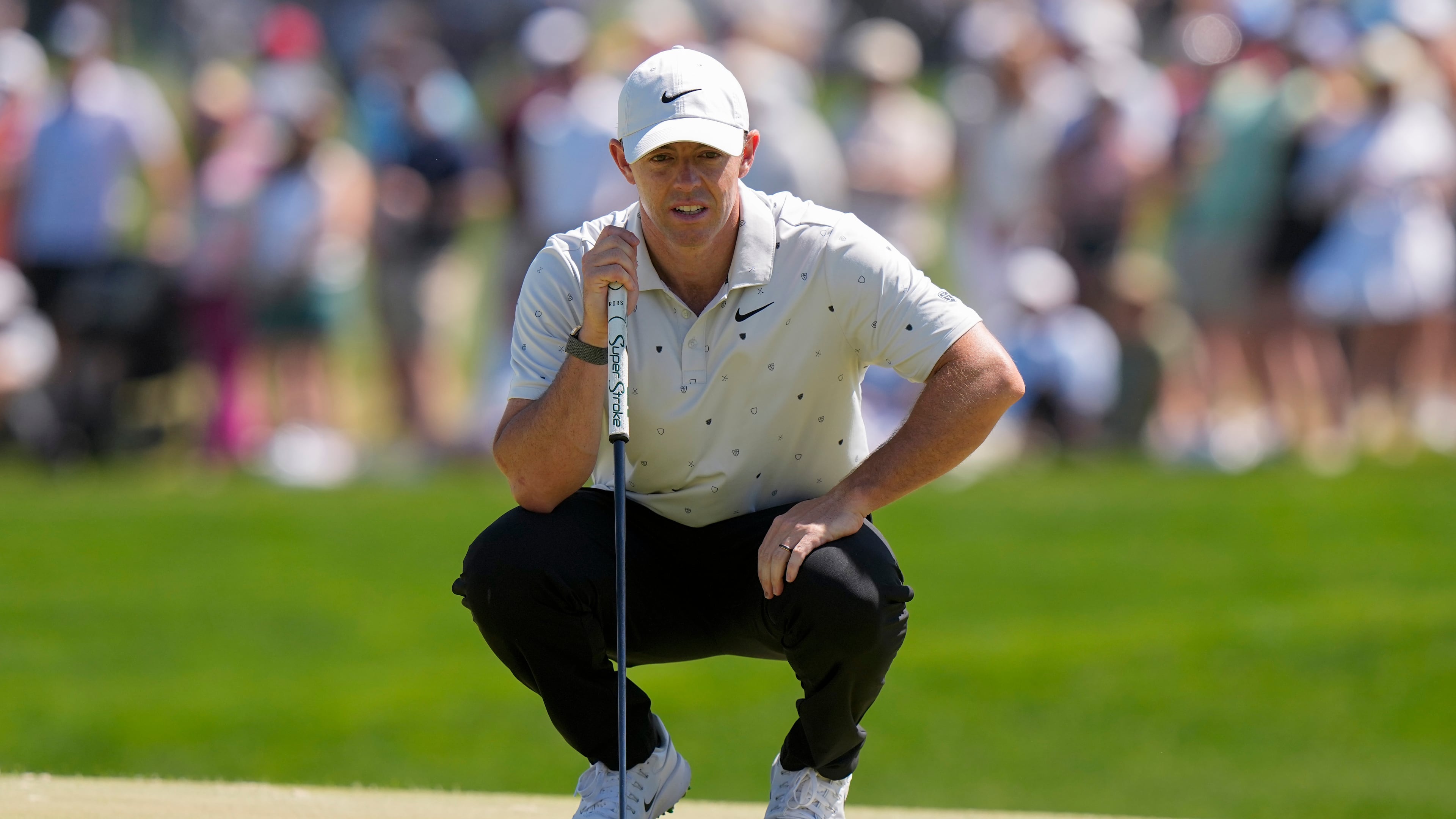 Rory McIlroy, of Northern Ireland, lines up his shot on the 16th green during the third round of the PGA Championship golf tournament at Aronimink Golf Club, Saturday, May 16, 2026, in Newtown Square, PA. (AP Photo/Frank Franklin II)