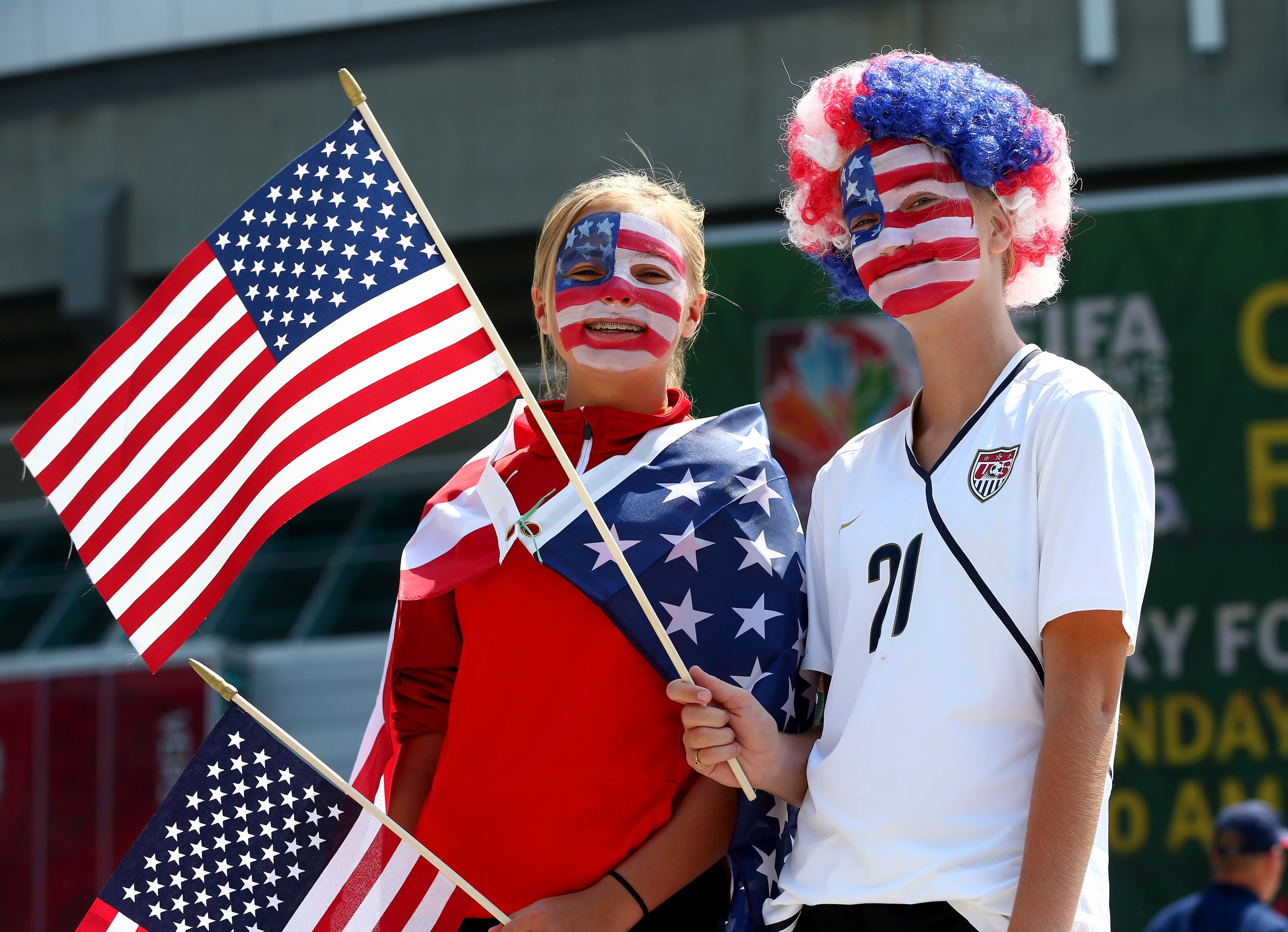 VANCOUVER, BC - JULY 05: Fans of the United States pose outside BC Place Stadium before the USA takes on Japan in the FIFA Women's World Cup Canada 2015 Final on July 5, 2015 in Vancouver, Canada. (Photo by Ronald Martinez/Getty Images)
