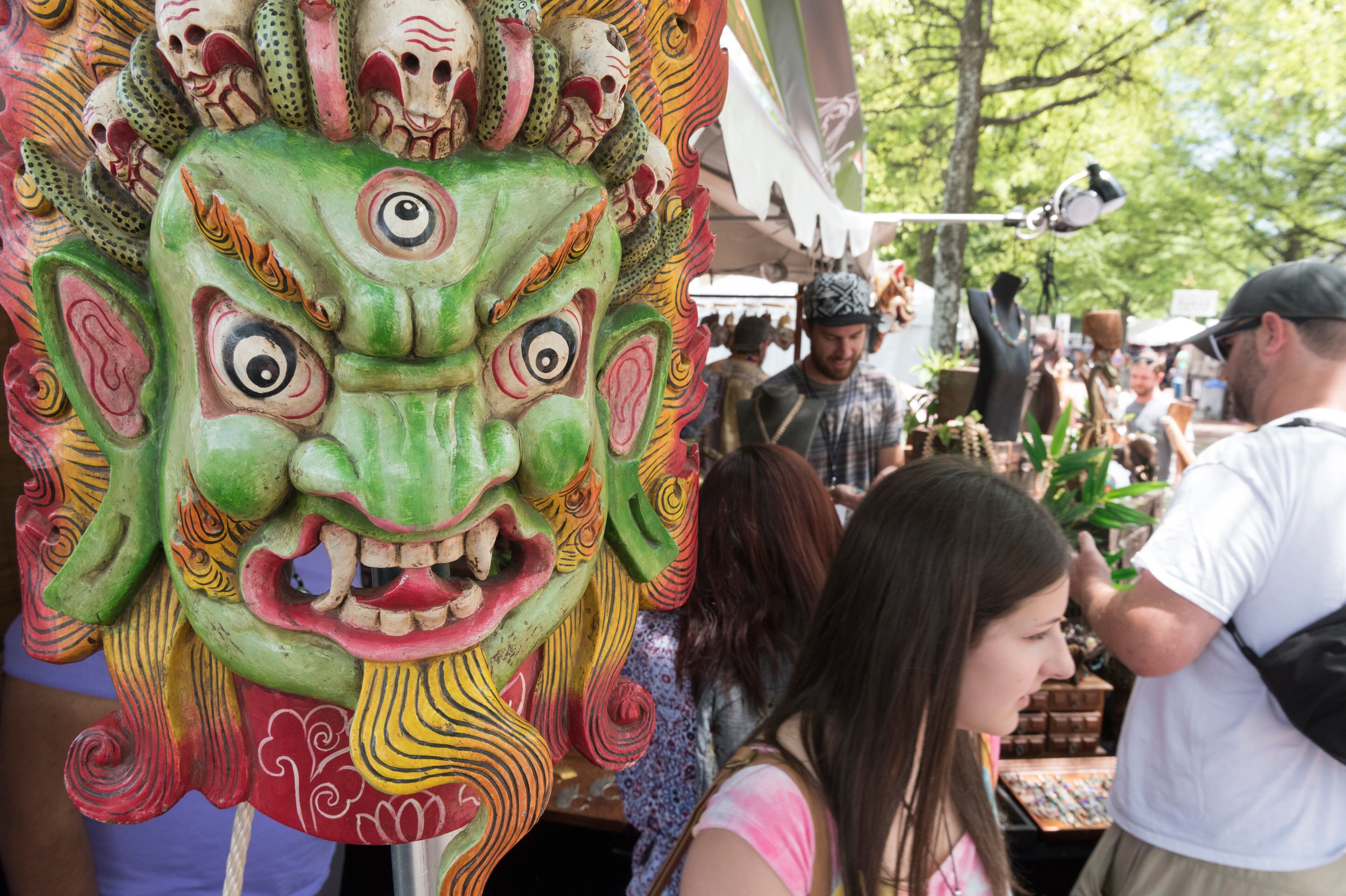 April 21, 2017, Atlanta - Festival goers browse various works of art and jewelry at the SweetWater 420 Fest at Centennial Olympic Park in Atlanta, Georgia, on Friday, April 21, 2017. (DAVID BARNES / DAVID.BARNES@AJC.COM)