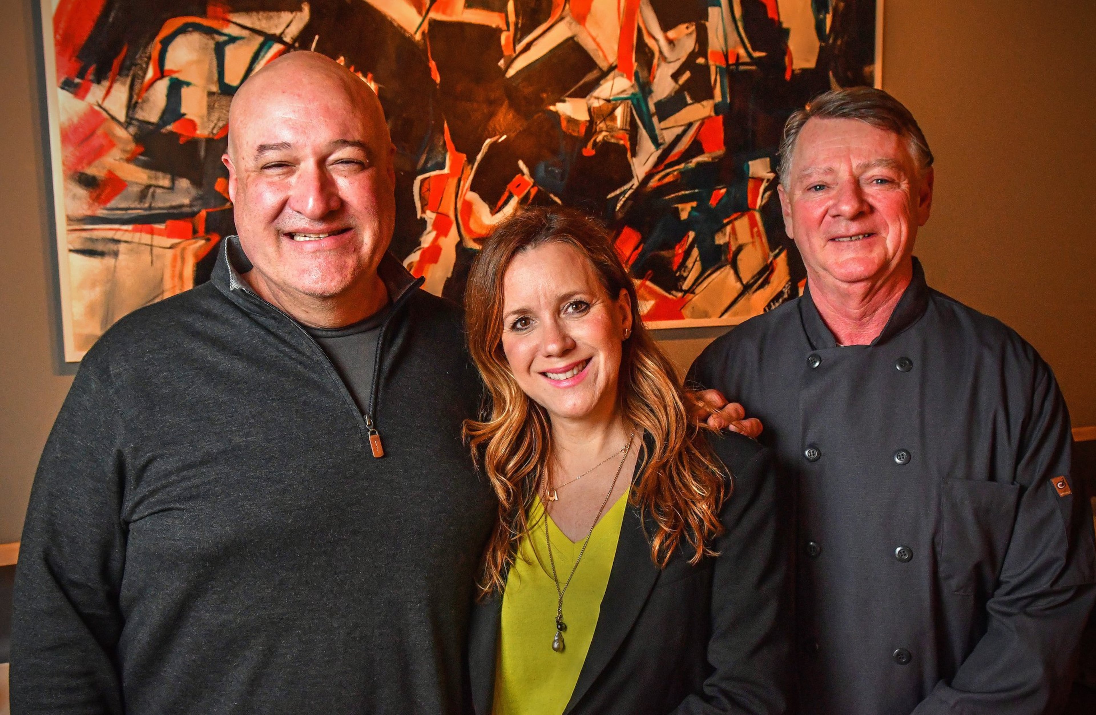L-R: Executive chef, Jimmy Carey, Camille Olabarrieta, executive chef, Bobby Holley at Jimmy'z Kitchen in Marietta. (Contributed by Chris Hunt Photography)
