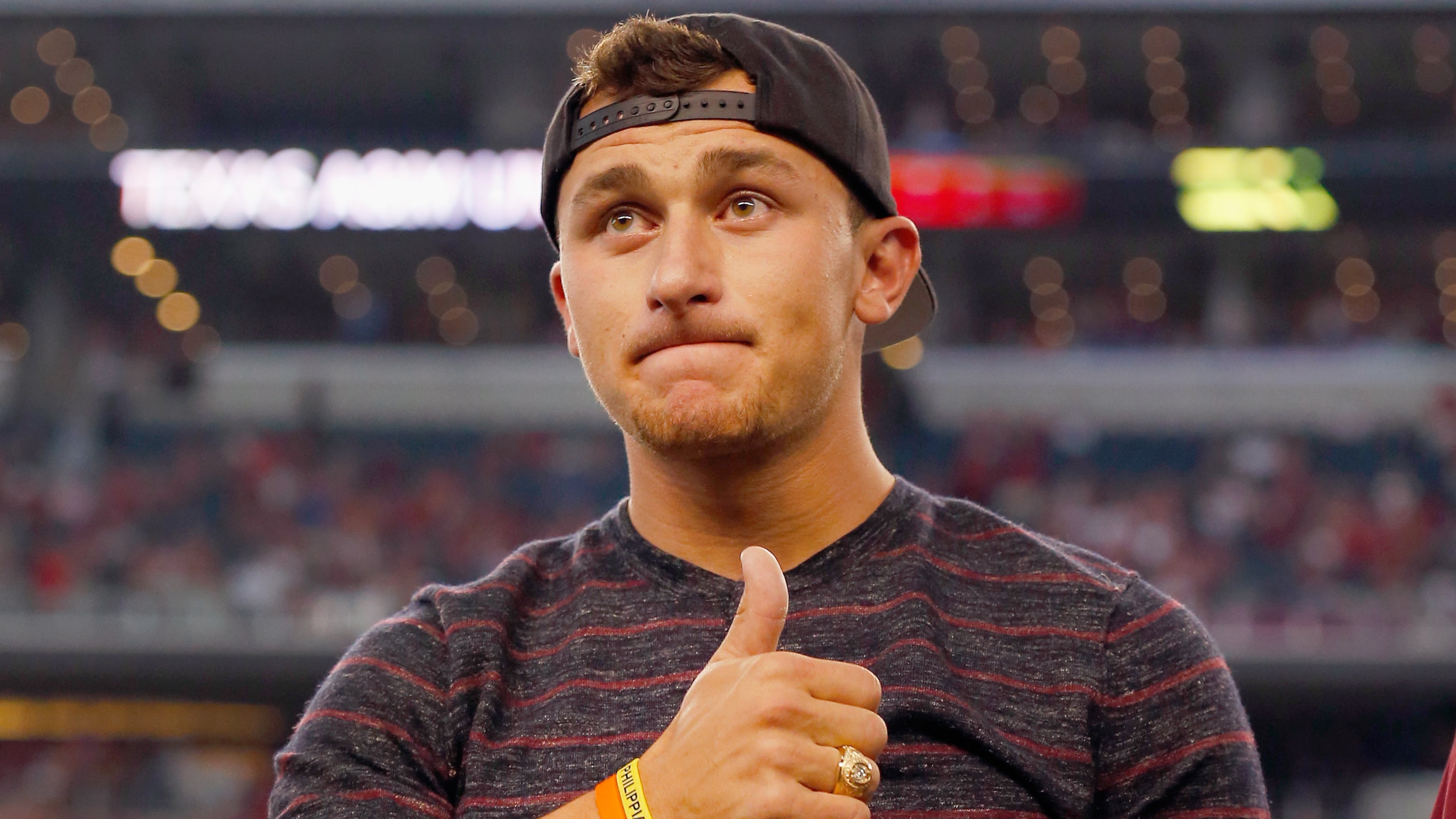 ARLINGTON, TX - SEPTEMBER 27: Johnny Manziel #2 of the Cleveland Browns reacts after receiving his Aggie Ring during half time of the Southwest Classic at AT&T Stadium on September 27, 2014 in Arlington, Texas. (Photo by Tom Pennington/Getty Images)
