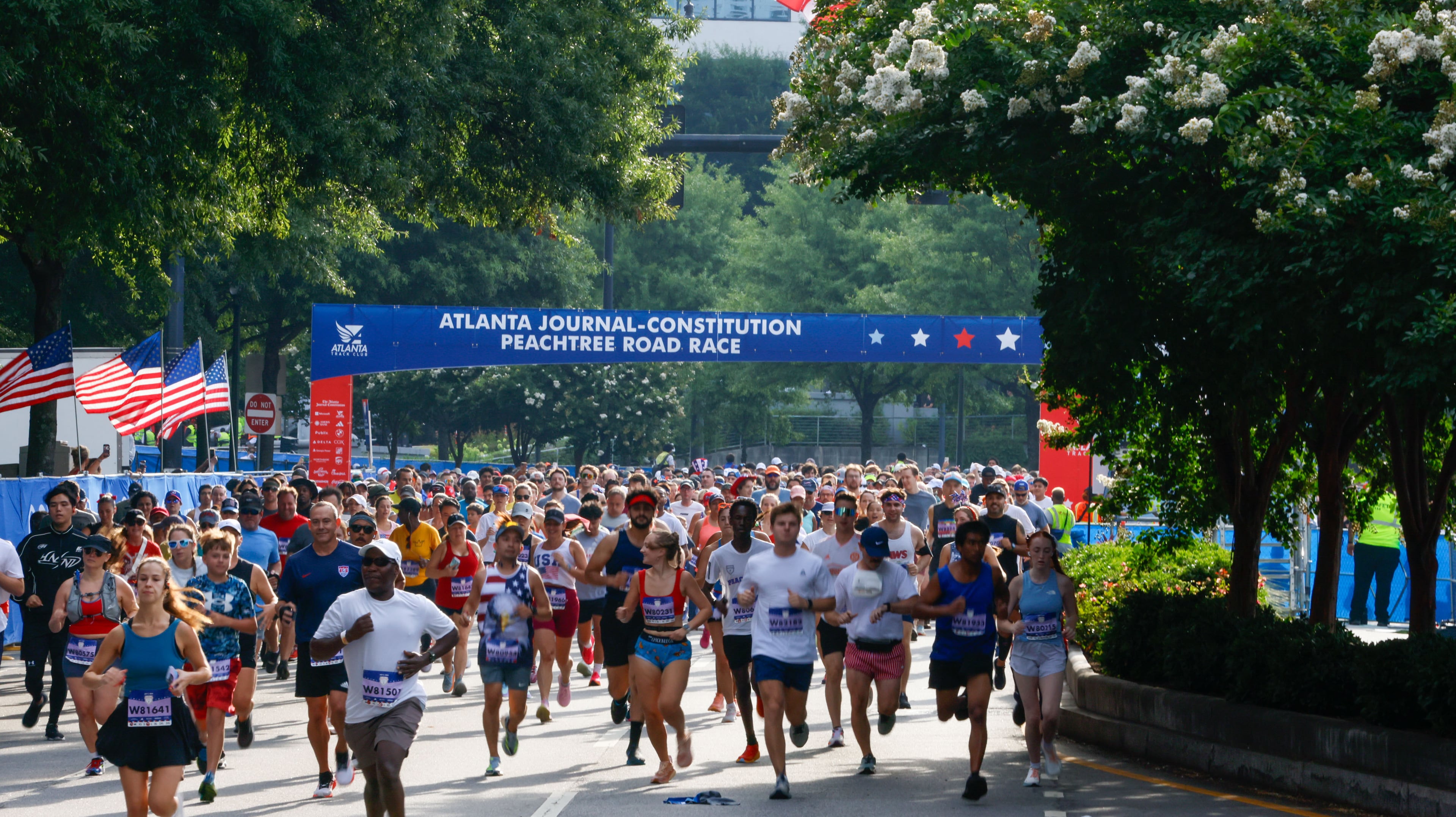 Peachtree runners participate during the 55th Atlanta Journal-Constitution Peachtree Road Race in Atlanta on Thursday, July 4, 2024.
(Miguel Martinez / AJC)
