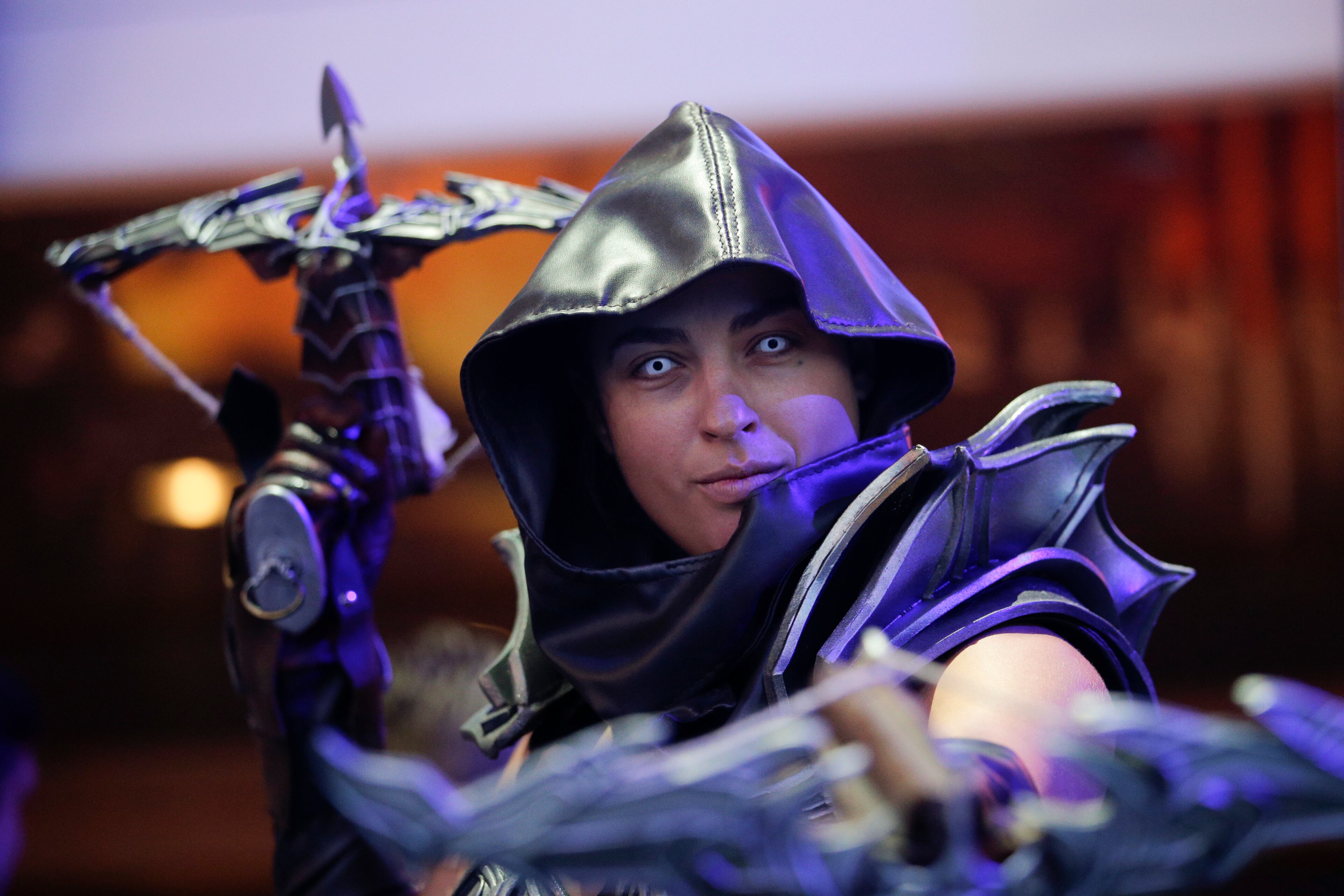 A model dressed as a character from the popular video game "Diablo" poses for photos during the Electronic Entertainment Expo in Los Angeles, Tuesday, June 11, 2013. (AP Photo/Jae C. Hong)
