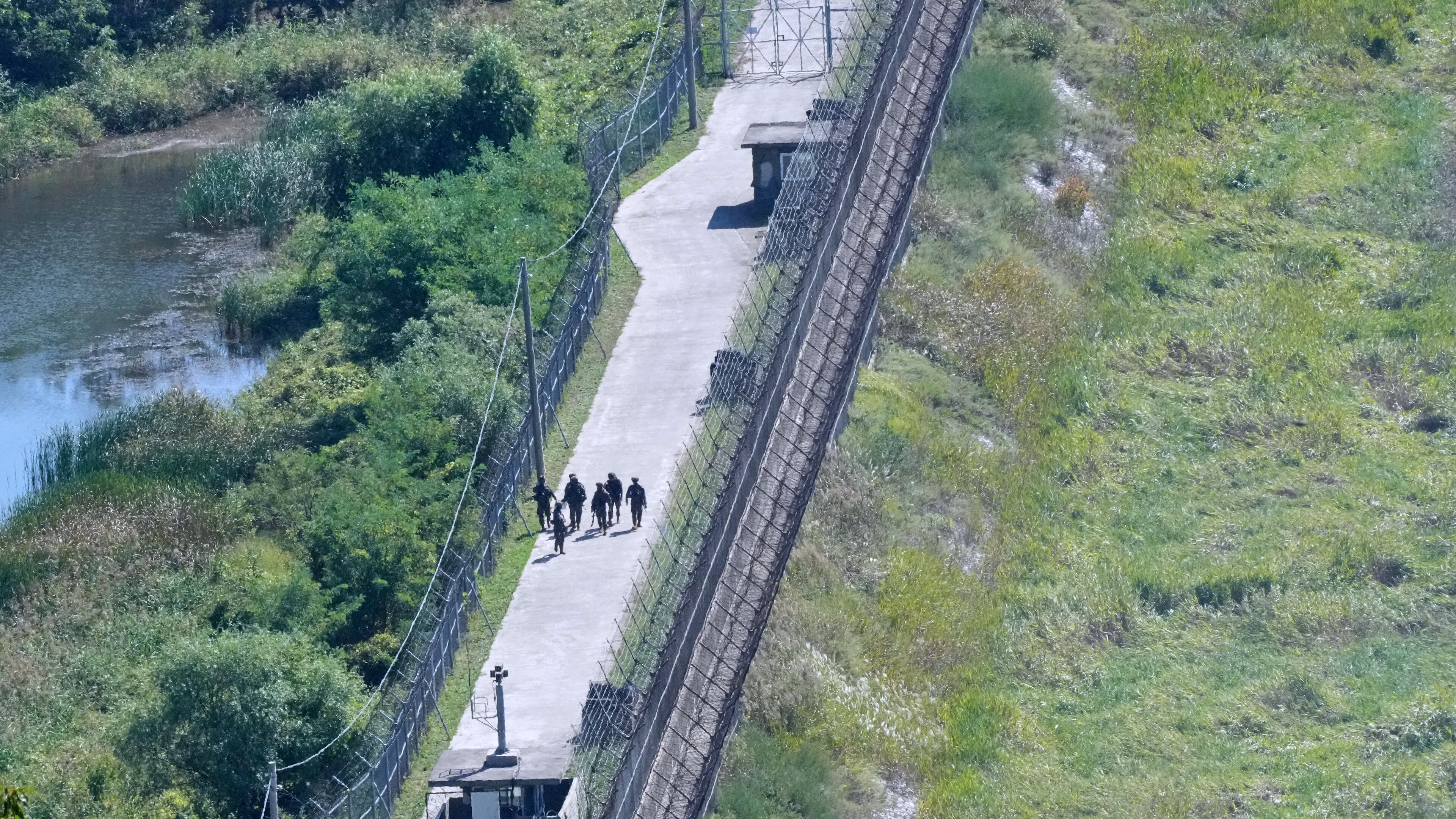 South Korean army soldiers patrol along the barbed-wire fence near the border with North Korea, in Paju, South Korea, Tuesday, Sept. 29, 2026. (AP Photo/Ahn Young-joon)