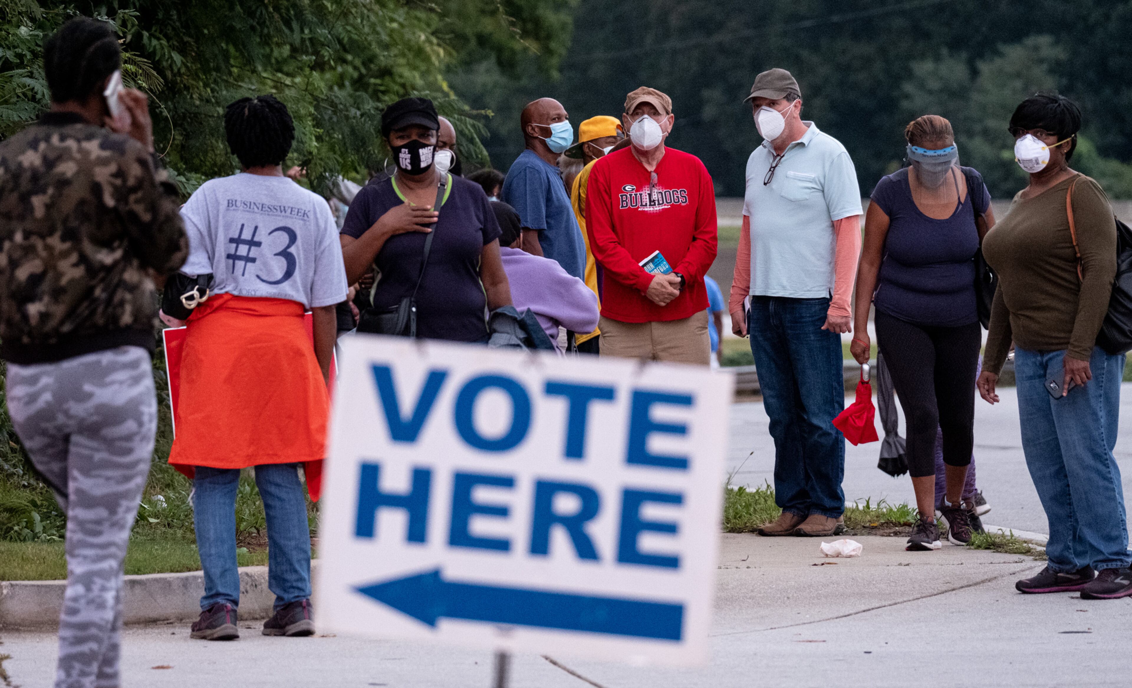 201012-Decatur-Hundreds of people waiting to vote form a line snaking out of the parking of the DeKalb County elections office in Decatur on Monday morning October 12, 2020 an hour after the polling place opened. Ben Gray for the Atlanta Journal-Constitution
