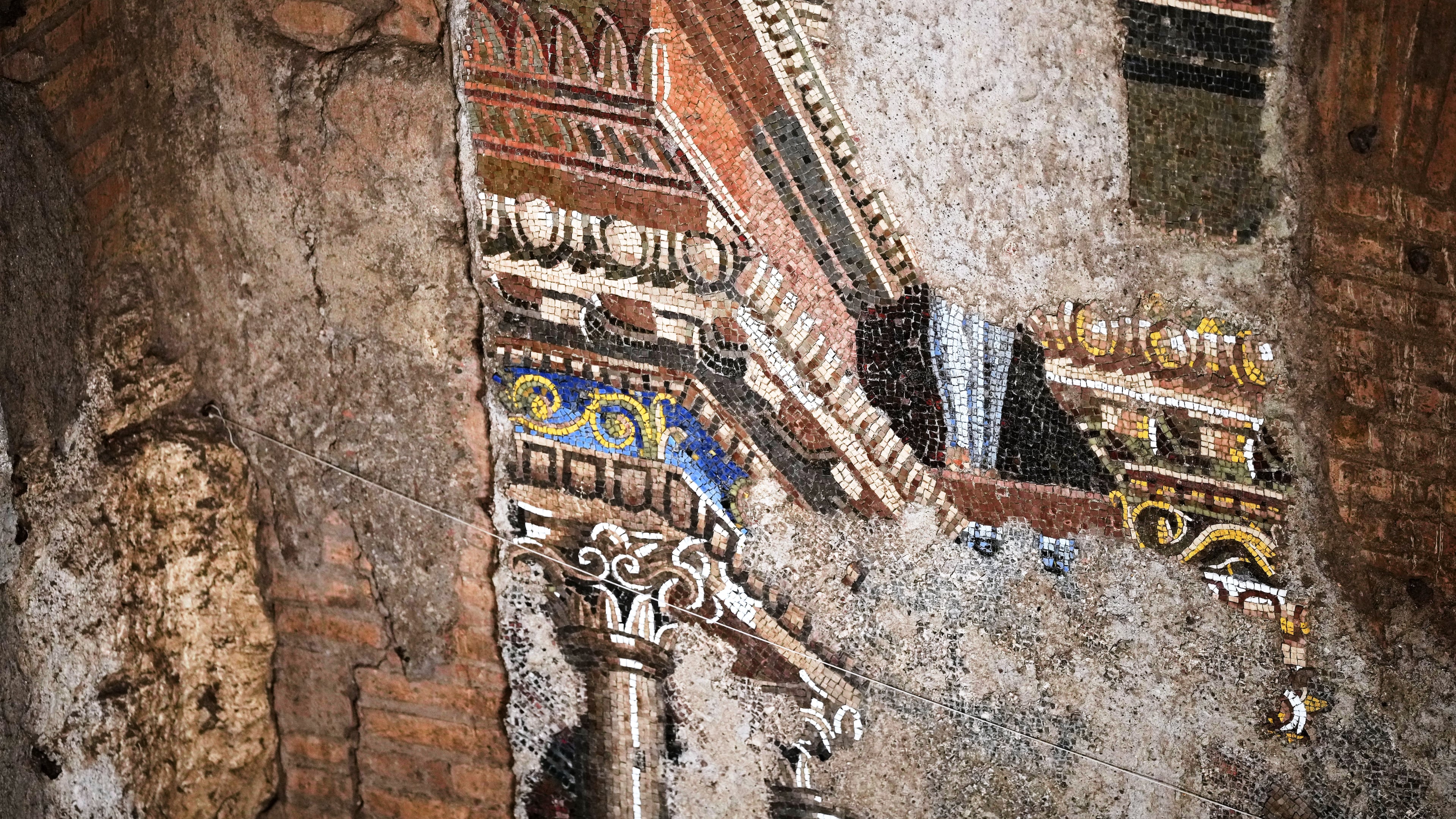 A section of the restored 15-meter ancient wall mosaic from "The Painted City" site, discovered in the late 1990s within the underground structures that served as foundations for the Baths of Trajan, is seen in Rome on Tuesday, Sept. 8, 2026. (AP Photo/Andrew Medichini)
