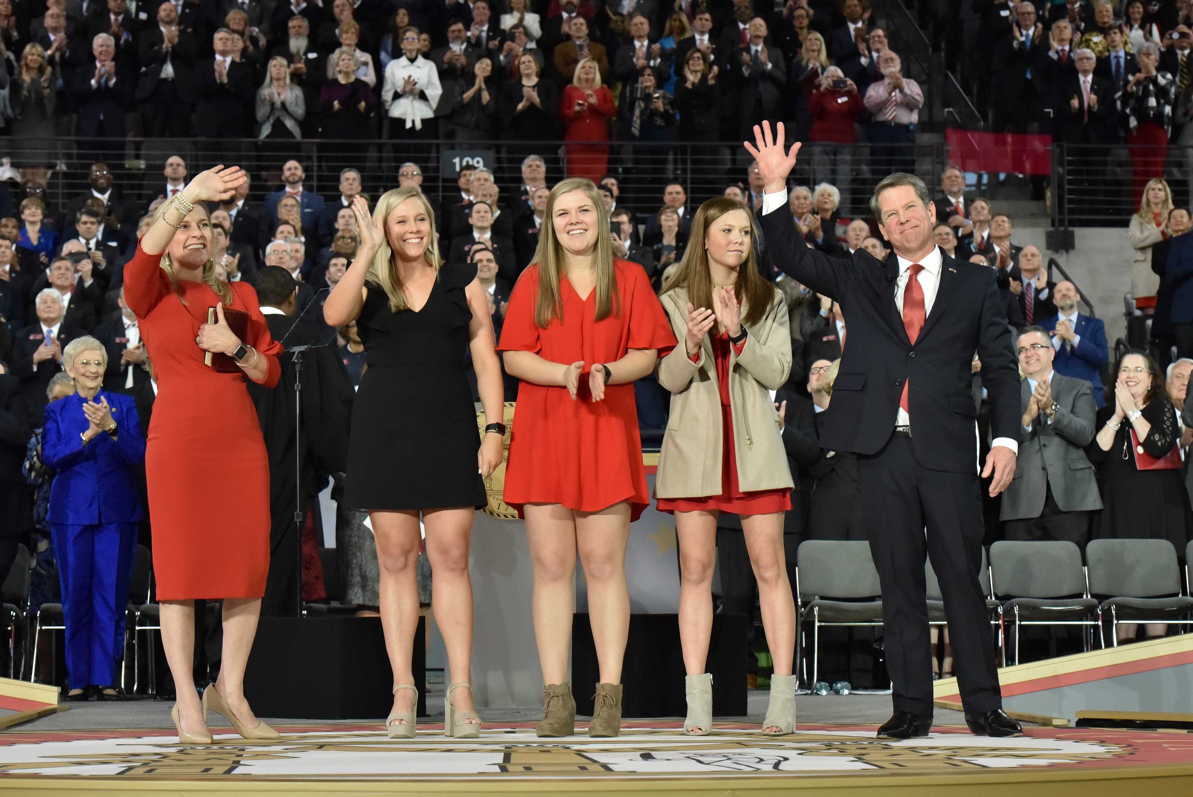 January 14, 2019 Atlanta - Georgia's 83rd Governor Brian Kemp, with wife Marty Kemp and daughters Jarrett, Lucy, and Amy Porter, waves to supporters during the swearing-in ceremony at McCamish Pavilion in Campus of Georgia Tech on Monday, January 14, 2019. HYOSUB SHIN / HSHIN@AJC.COM