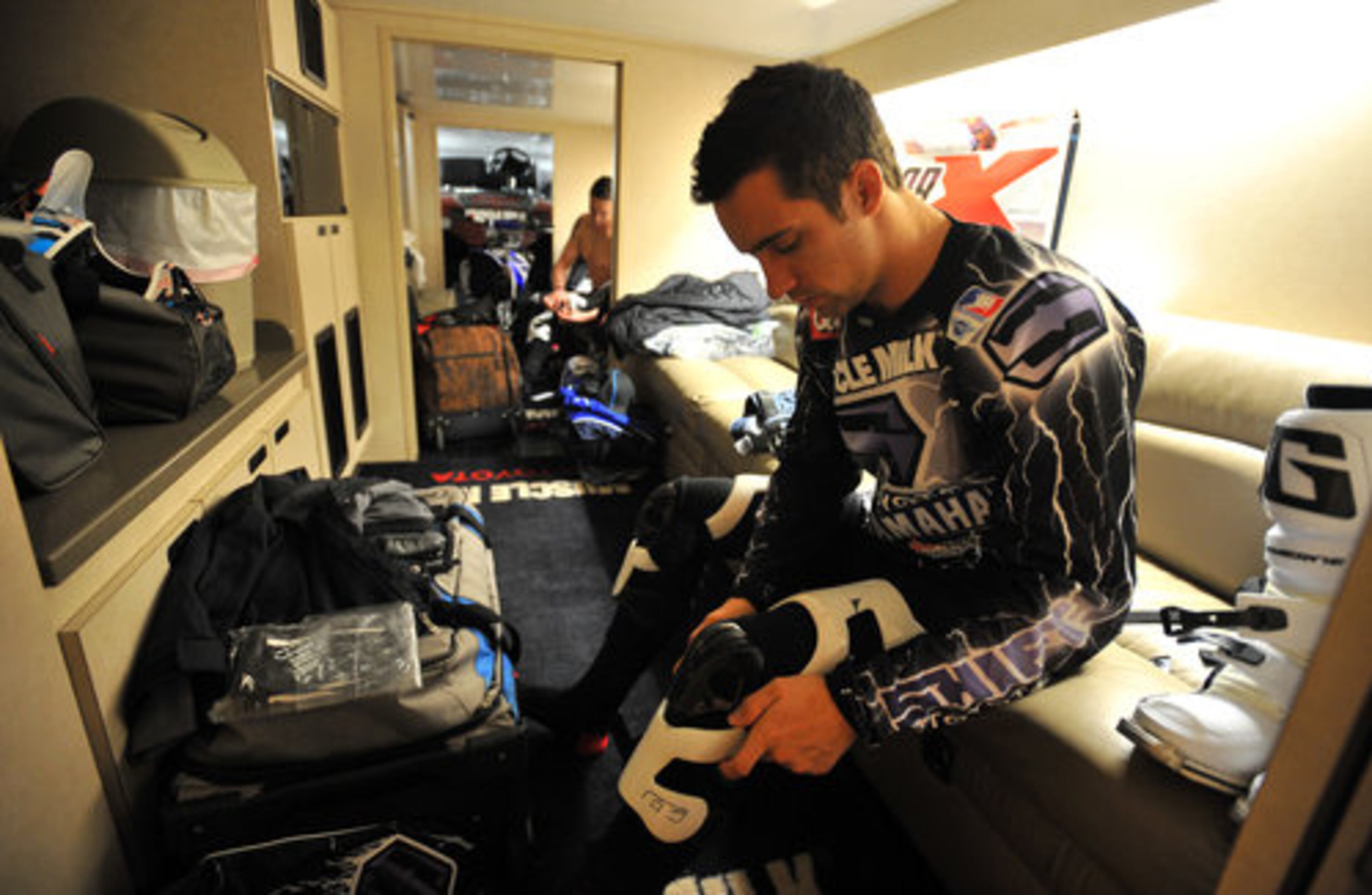 Michael Byrne with Joe Gibbs Racing puts on his protective gear before riding the track for a media demo and track test session at the Georgia Dome.