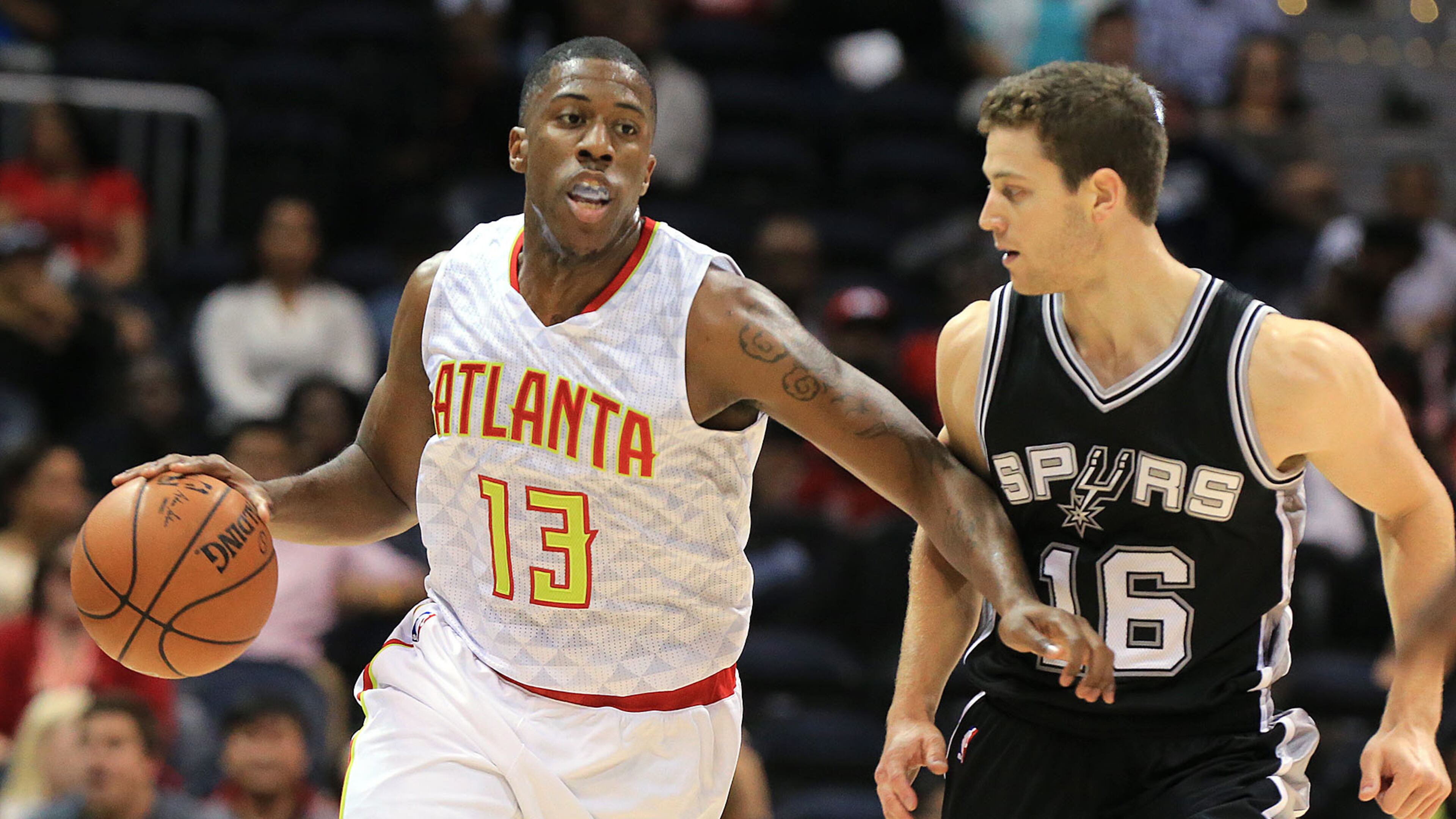 101415 ATLANTA: Hawks guard Lamar Patterson drives against Spurs guard Jimmer Fredette during the second half in their preseason basketball game on Wednesday, Oct. 14, 2015, in Atlanta. Curtis Compton / ccompton@ajc.com