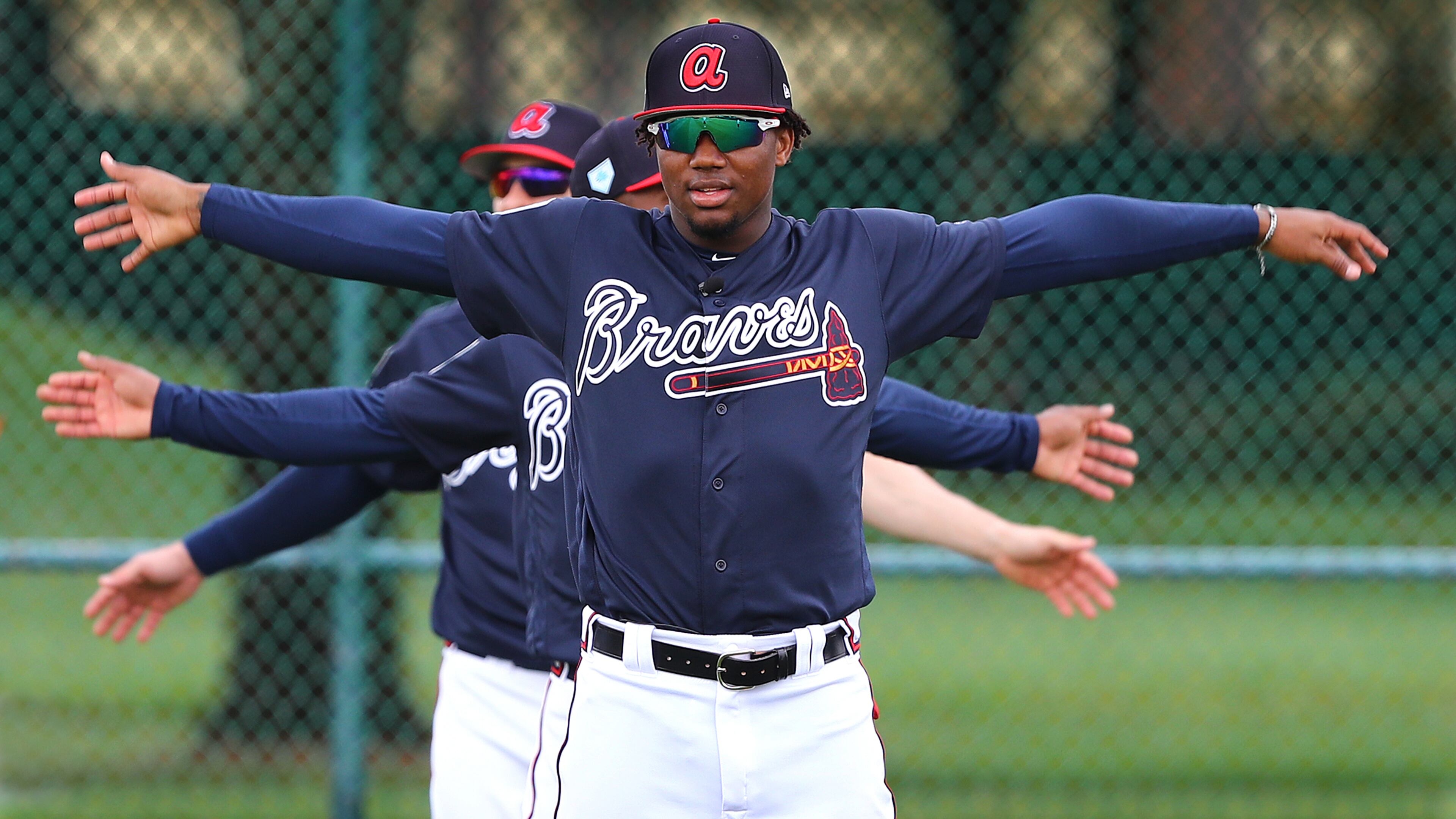 Atlanta Braves outfielder Ronald Acuna loosens up with teammates during the first full squad workout at spring training Thursday, Feb. 21, 2019, in the ESPN Wide World of Sports Complex in Lake Buena Vista, Fla.