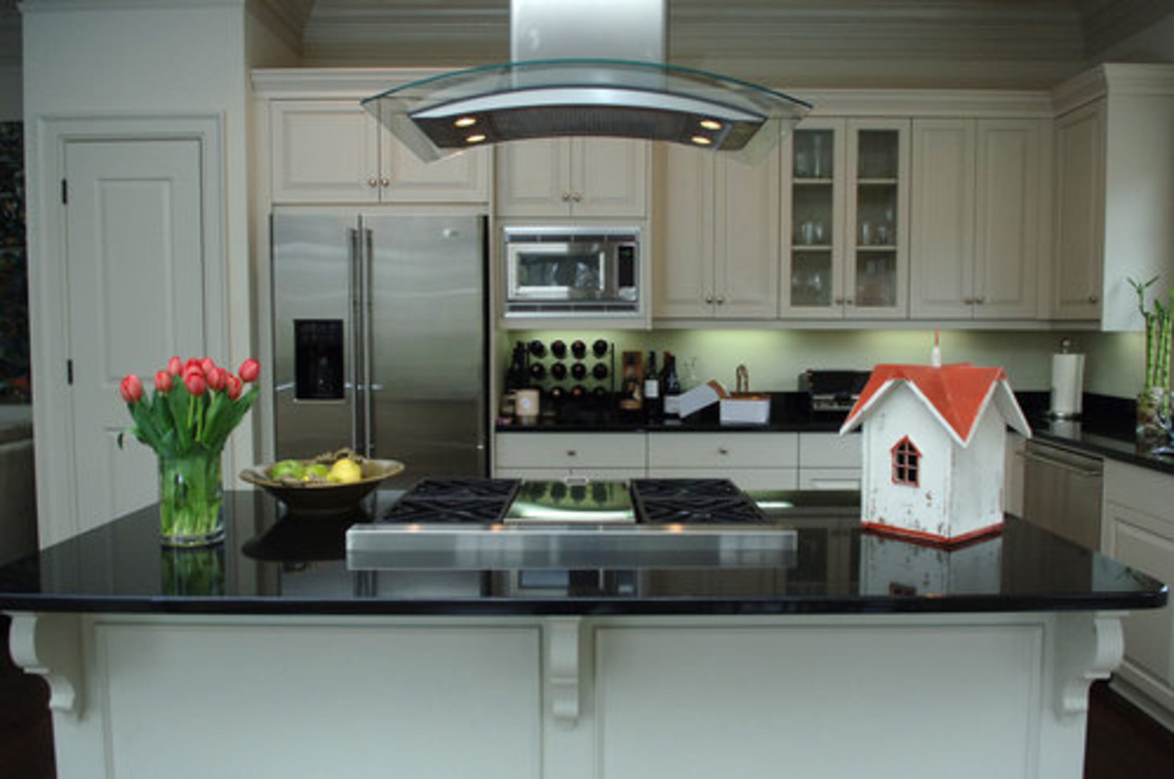 The folky bird house on the right offers a funky counterpoint to the sleek lines of the modern kitchen. The little house is a favorite art object for Kansas because the sometime artist bought it with money he got from selling a painting at his first art exhibition. "It's a happy memory," Kansas said.