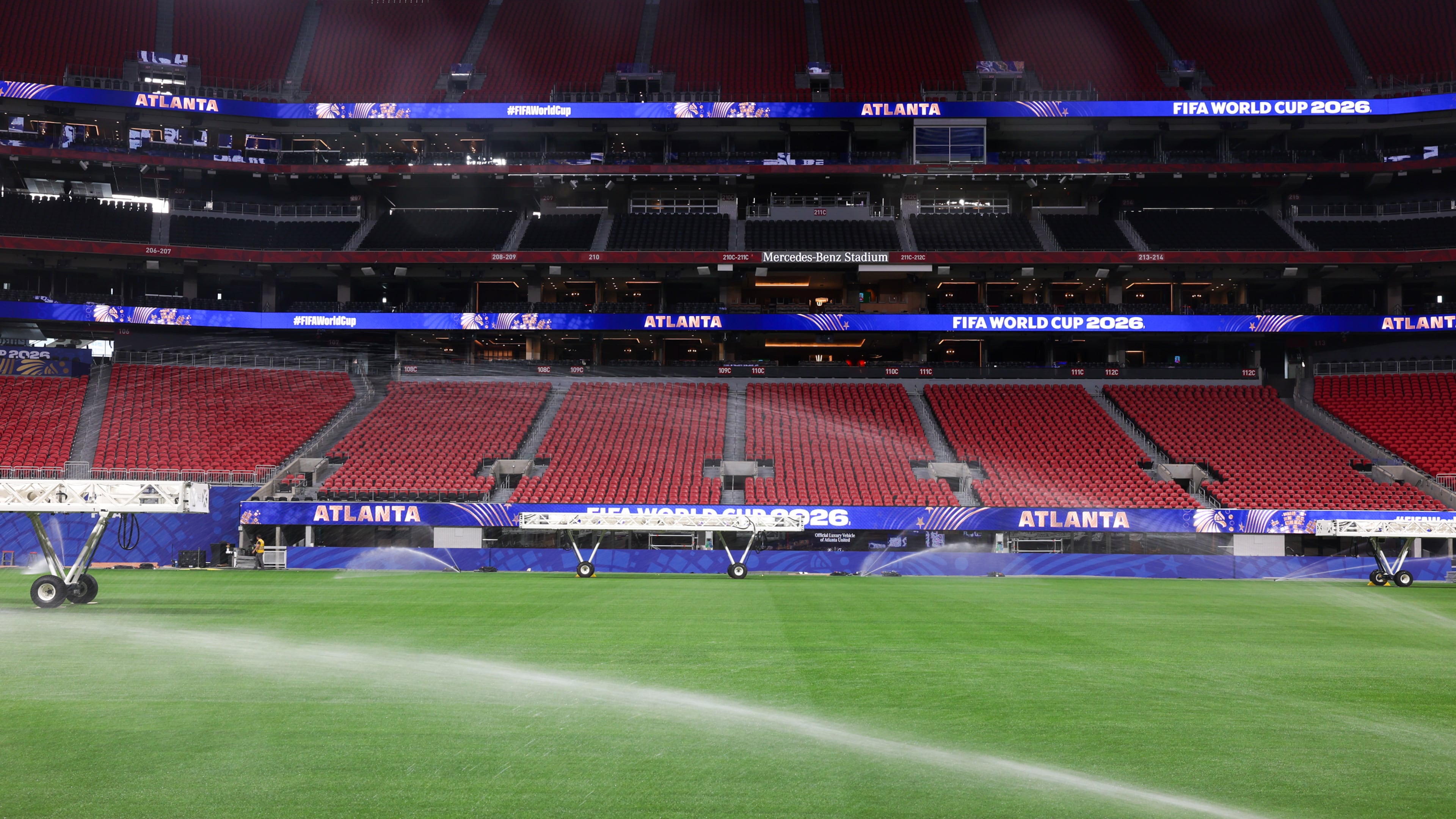 The newly installed playing surface for the FIFA World Cup is watered at the stadium in Atlanta on May 21, 2026. The pitch is Kentucky bluegrass mixed with perennial ryegrass with artificial fibers stitched in. It came from a turf farm in Colorado. (Arvin Temkar/AJC)