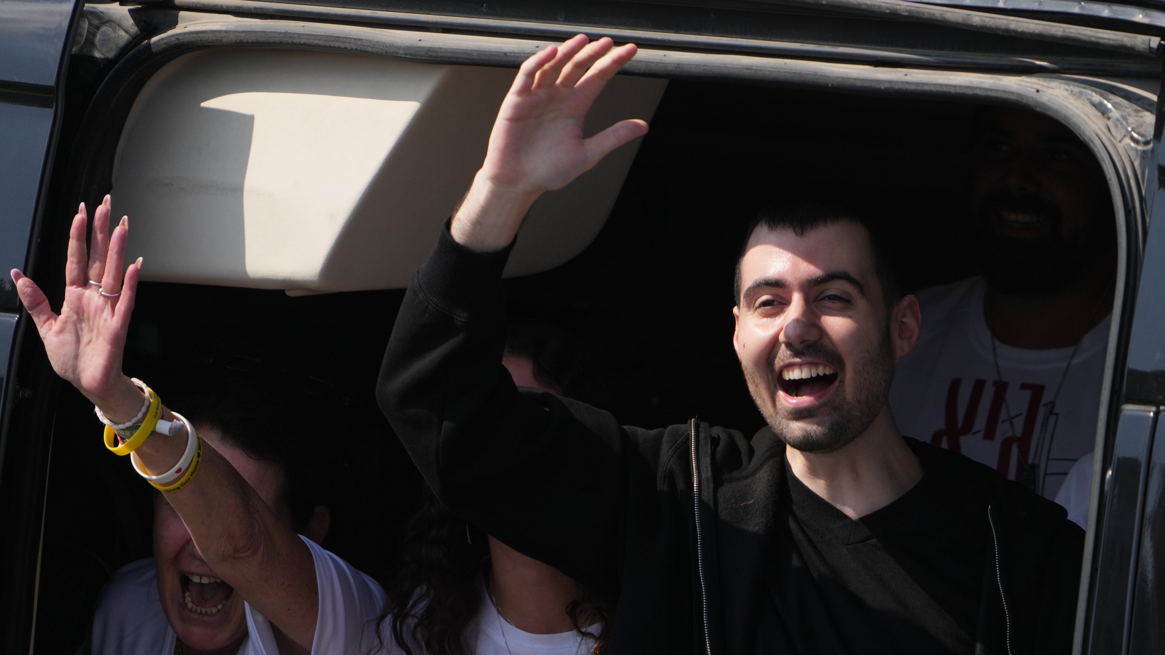 FILE - Freed Israeli hostage Guy Gilboa-Dalal gestures from a van as he arrives at Beilinson hospital in Petah Tikva, Israel, after he was released from Hamas captivity in the Gaza Stripl, Monday, Oct. 13, 2025. (AP Photo/Ariel Schalit, File)