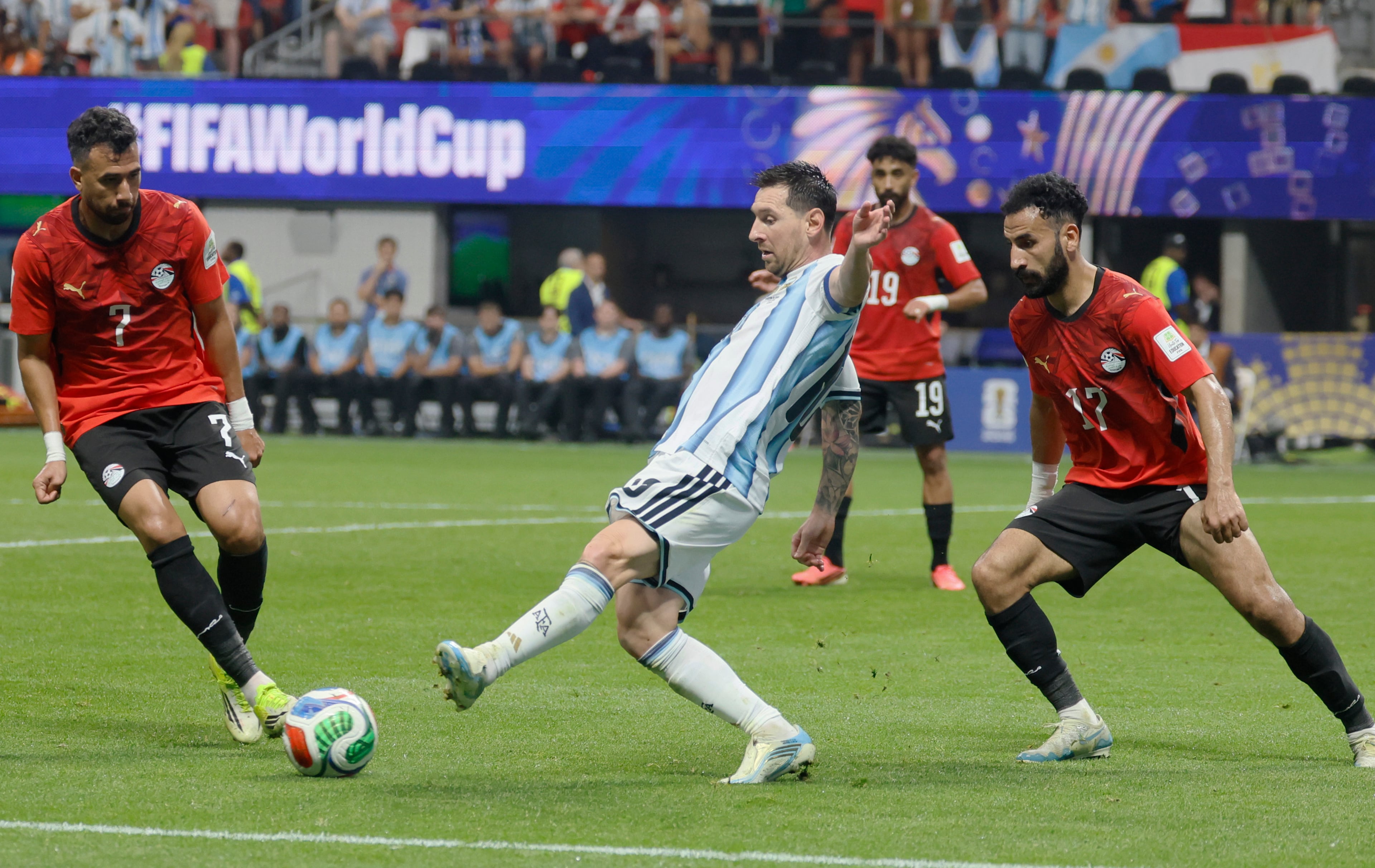 Argentina's Lionel Messi controls ball between Egypt's Trezeguet , left, and Mohanad Lashin, right, during second half of Argentina vs. Egypt FIFA World Cup match at Atlanta Stadium (Mercedes-Benz Stadium) on Tuesday, July 7, 2026. (Miguel Martinez/AJC)