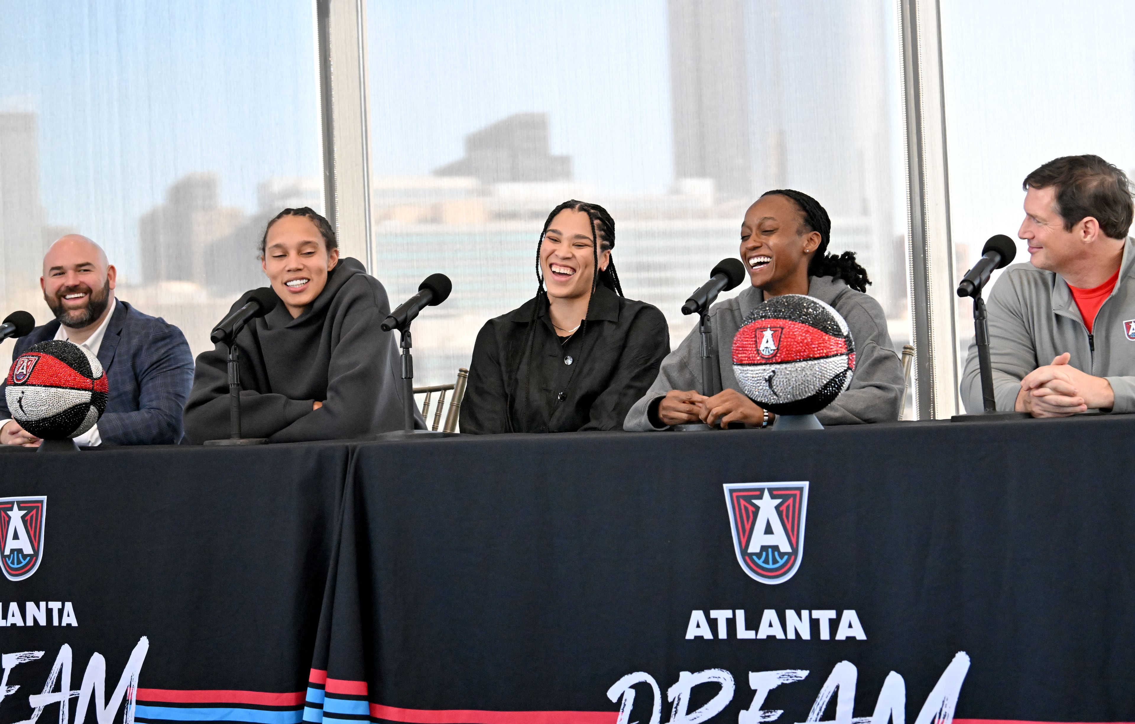 Atlanta Dream’s new players (from left) Brittney Griner, Brionna Jones and Shatori Walker-Kimbrough sit with general manager Dan Padover (left) and new head coach Karl Smesko (right). (Hyosub Shin / AJC)