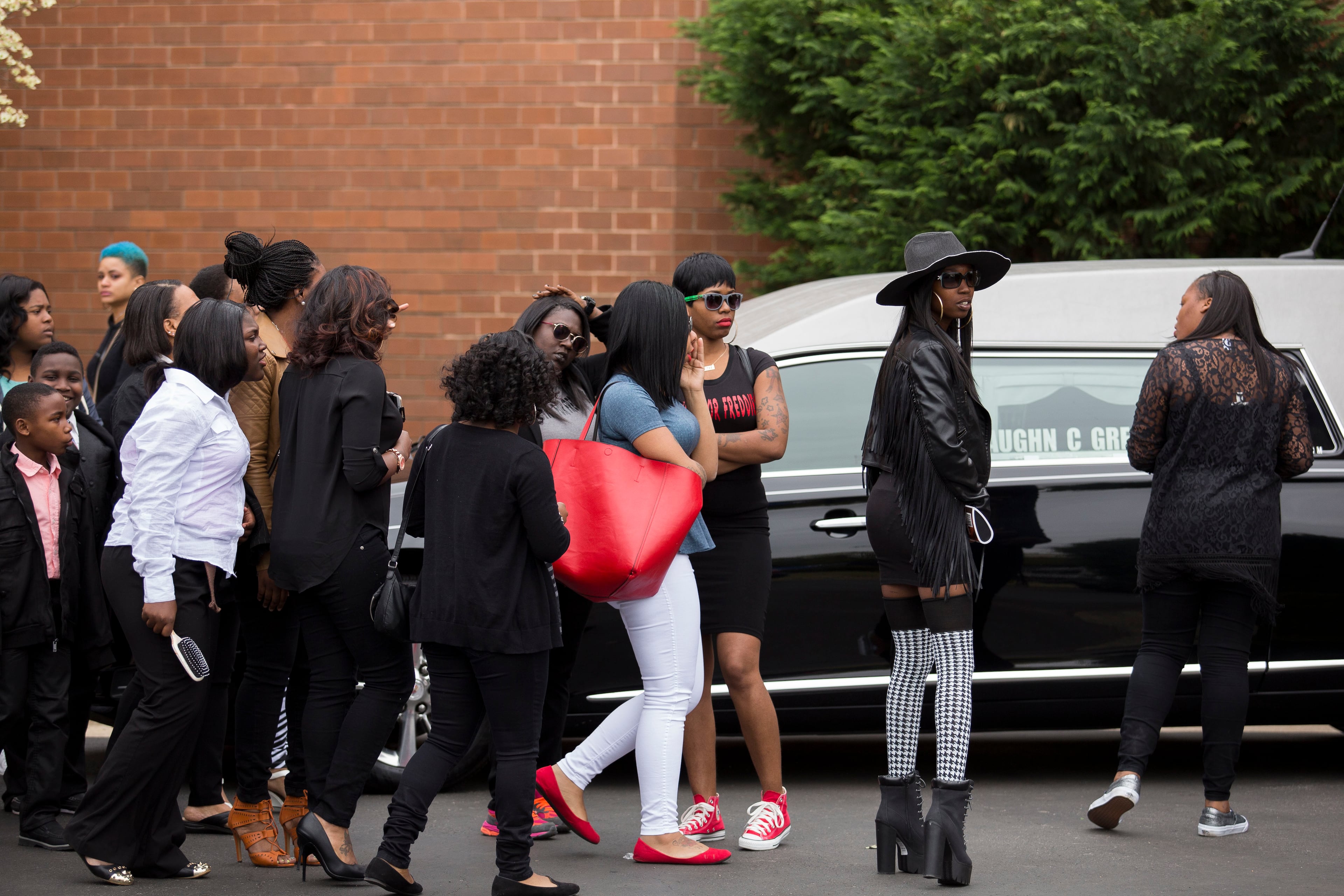 BALTIMORE, MD - APRIL 27: Mourners arrive at New Shiloh Baptist Church for the funeral service for Freddie Gray, April 27, 2015 in Baltimore, Maryland. Gray, 25, was arrested for possessing a switch blade knife April 12 outside the Gilmor Homes housing project on Baltimore's west side. According to his attorney, Gray died a week later in the hospital from a severe spinal cord injury he received while in police custody. (Drew Angerer/Getty Images)