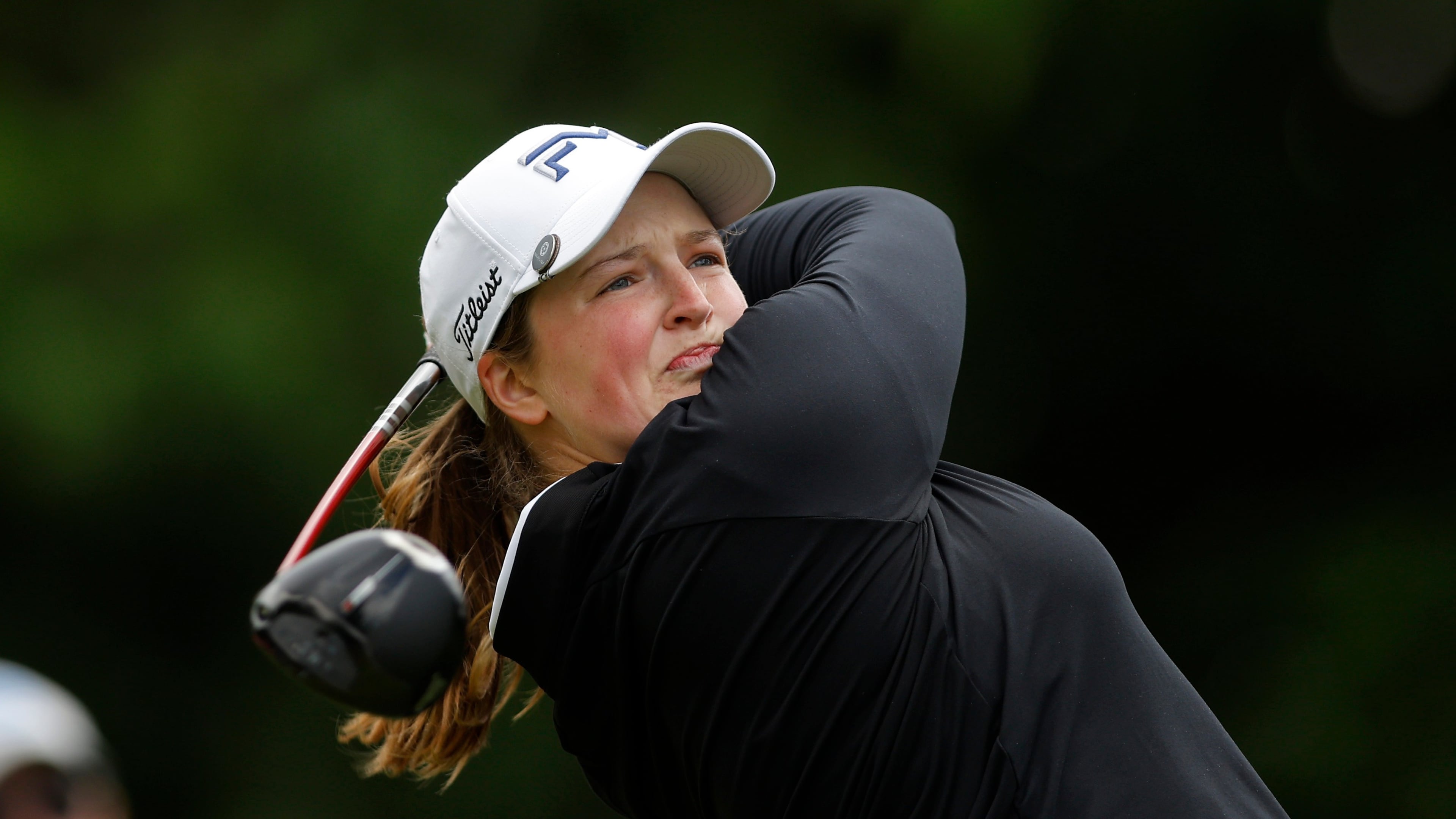 Lottie Woad, of England, watches her tee shot on the fourth hole during the first round of the Meijer LPGA Classic golf tournament, Thursday, June 18, 2026, in Belmont, Mich. (AP Photo/Al Goldis)