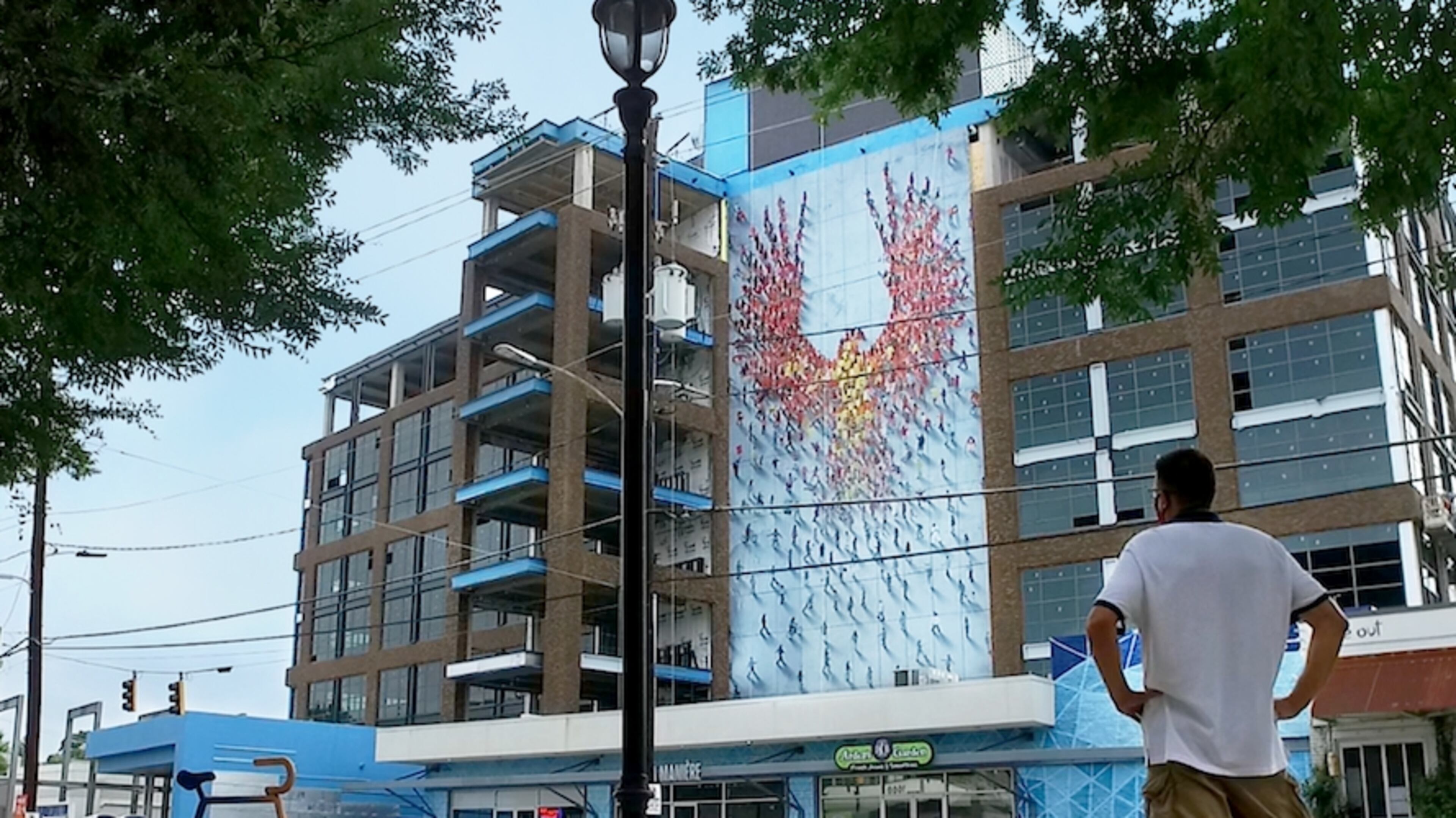 Atlanta artist Craig Alan's mural, "From the Ground Up," rises more than 90 feet over Howell Mill Road in West Midtown.
Courtesy of 8West