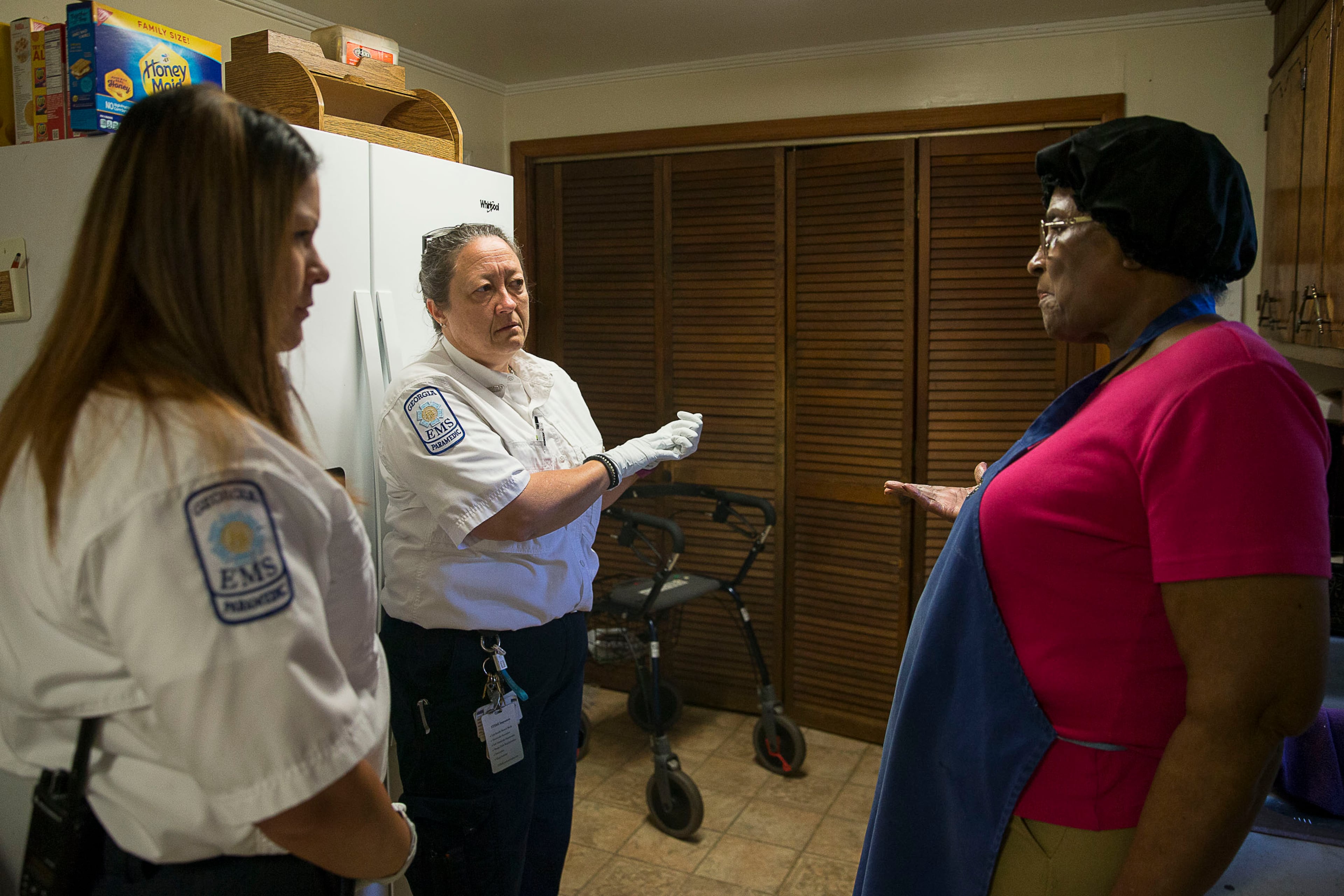 10/03/2019 -- Washington, Georgia -- Wilkes County Deputy EMA Director and paramedic Amy Howard (second from left) and Wilkes County paramedic Rebekah Echols (left) listen as Washington resident Jessie Gilmore, 80, (right) explains how her 86-year-old husband had an early morning fall at their residence, Thursday, October 3, 2019. Amy says Wilkes County has a large elderly population and some of their morning calls are for falls. (Alyssa Pointer/Atlanta Journal Constitution)