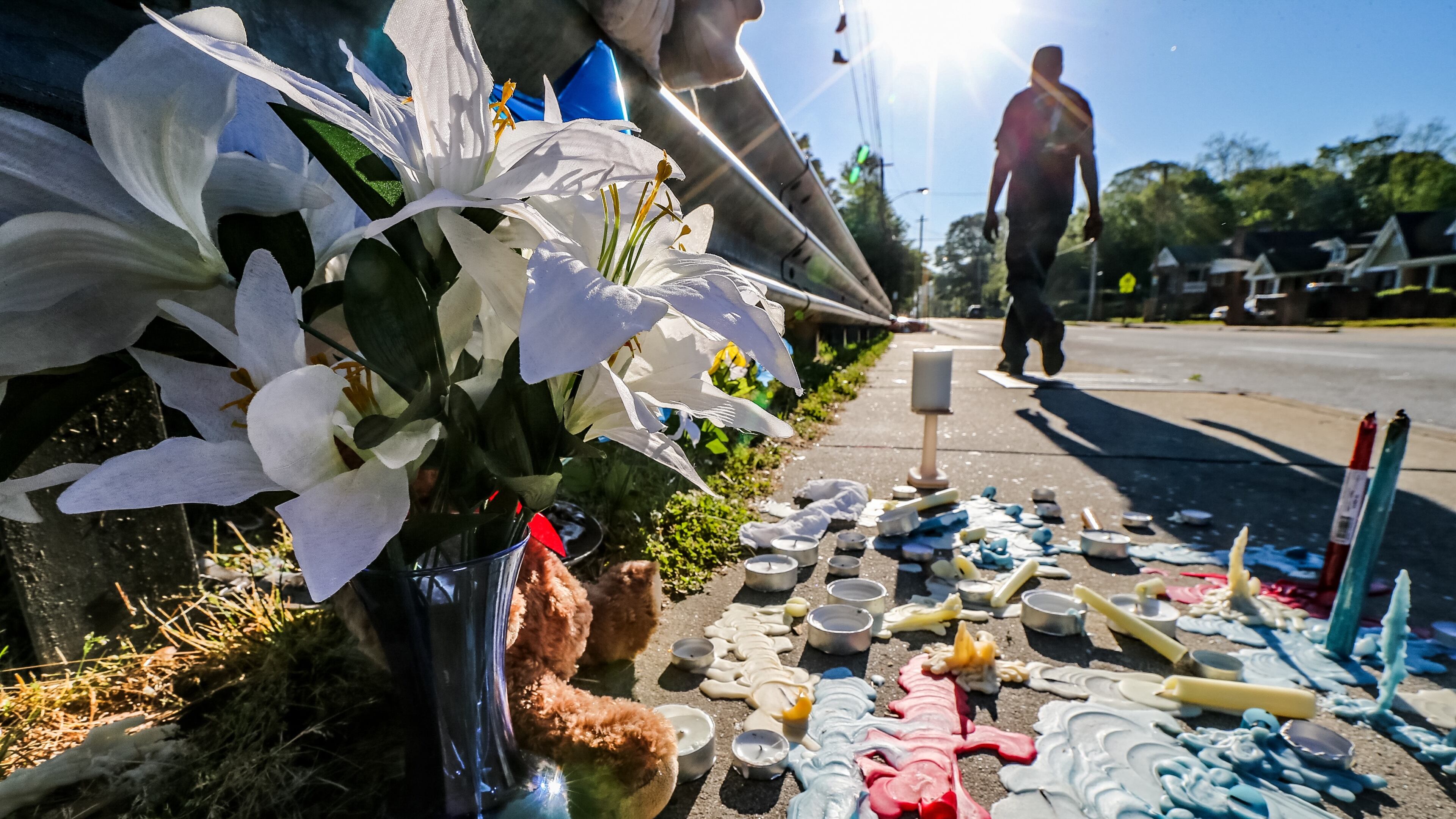A memorial was growing Mon., April 18, 2016, at the site where three children were struck by a vehicle that jumped a curb in northwest Atlanta. JOHN SPINK / JSPINK@AJC.COM