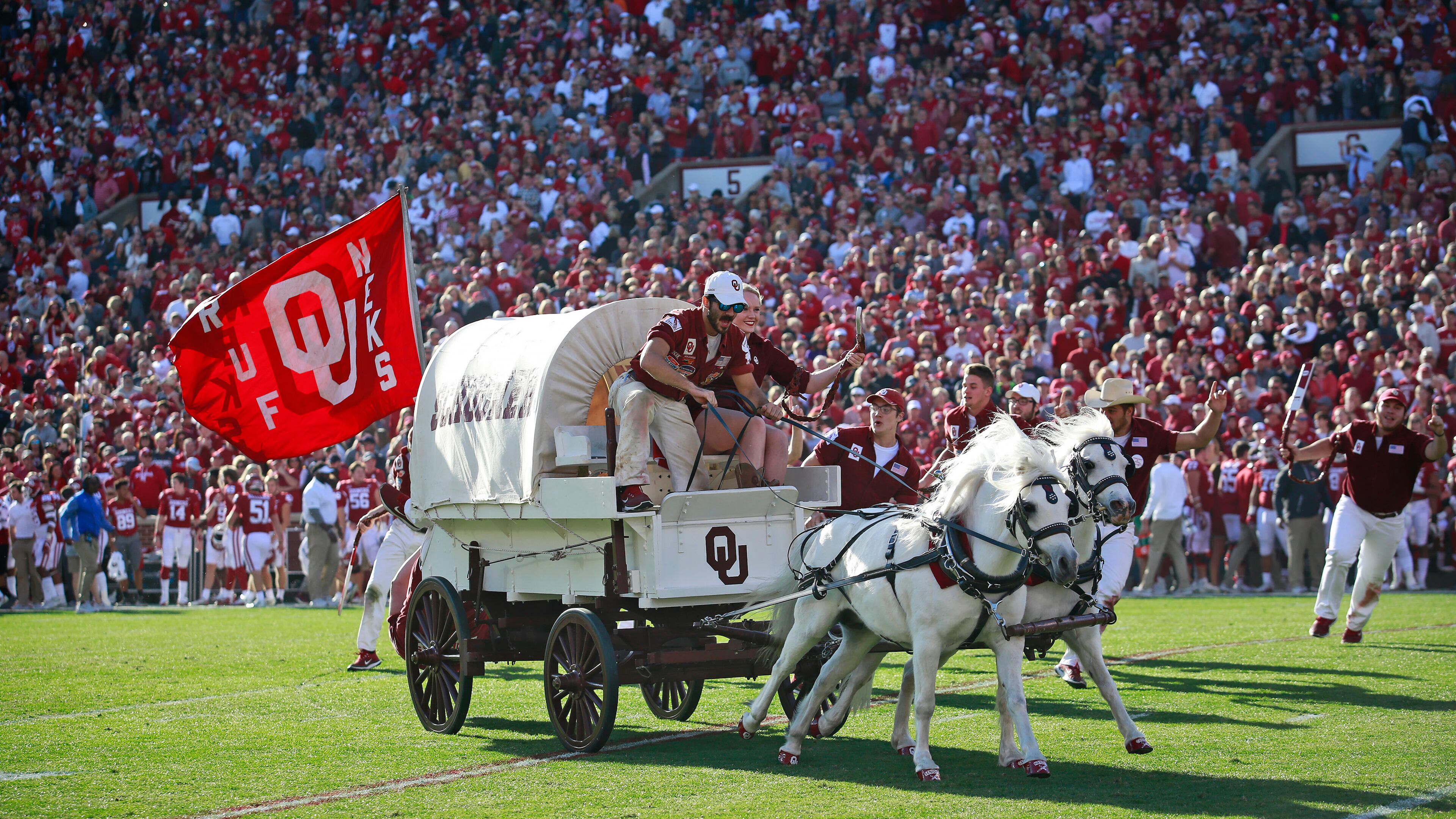 NORMAN, OK - NOVEMBER 25: The Sooner Schooner takes the field after a touchdown against the West Virginia Mountaineers at Gaylord Family Oklahoma Memorial Stadium on November 25, 2017 in Norman, Oklahoma. Oklahoma defeated West Virginia 59-31. (Photo by Brett Deering/Getty Images) *** Local Caption ***