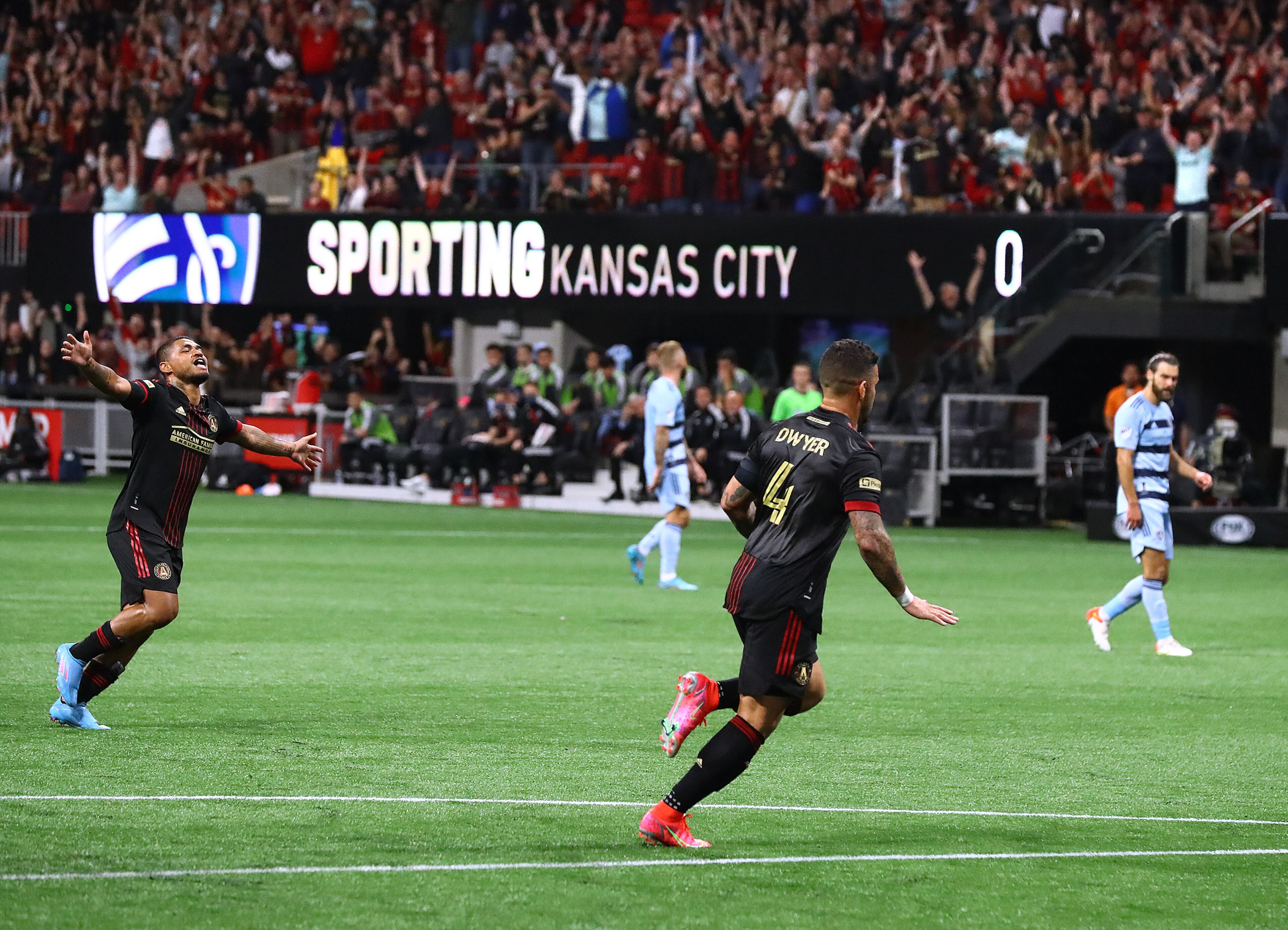 022722 : Atlanta United attacker Josef Martinez runs to celebrate with Dom Dwyer (right) after Dwyer scores a goal for a 2-0 lead over Sporting KC in an MLS soccer match on Sunday, Feb. 27, 2022, in Atlanta. Atlanta United won its home opener 3-1. “Curtis Compton / Curtis.Compton@ajc.com”`