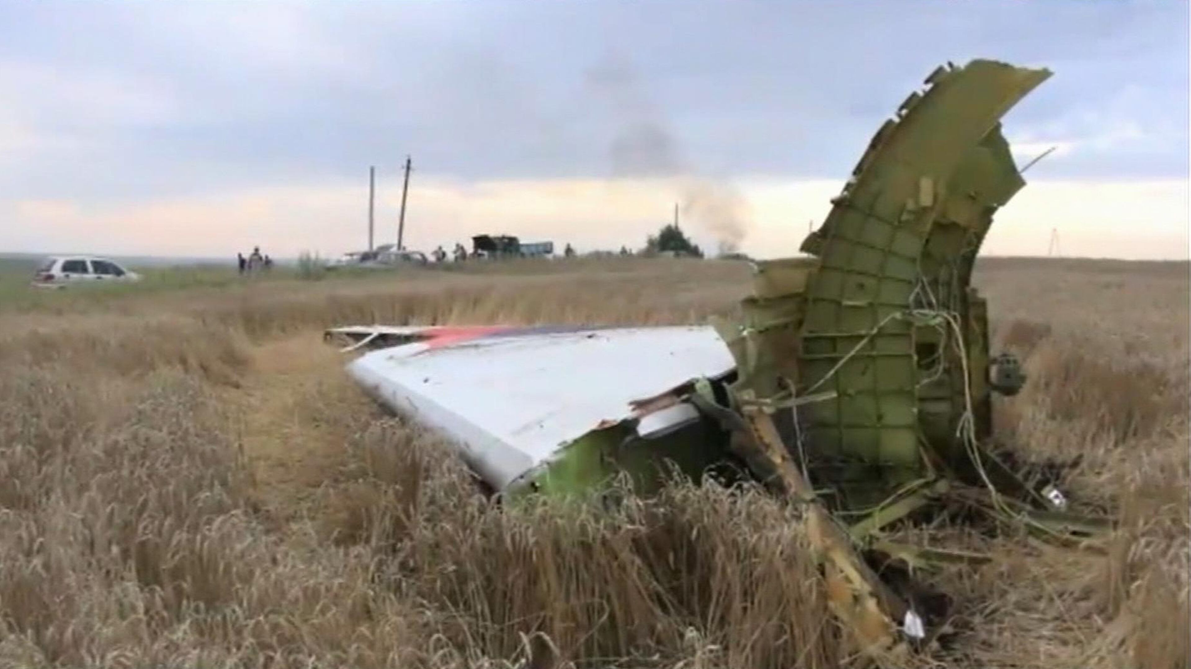 In this image taken from video, Thursday July 17, 2014, showing part of the wreckage of a passenger plane carrying 295 people was shot down Thursday as it flew over the country and plumes of black smoke rose up near a rebel-held village Hrabove, in eastern Ukraine. Malaysia Airlines tweeted that it lost contact with one of its flights as it was traveling from Amsterdam to Kuala Lumpur over Ukrainian airspace. (AP Photo / Channel 1)