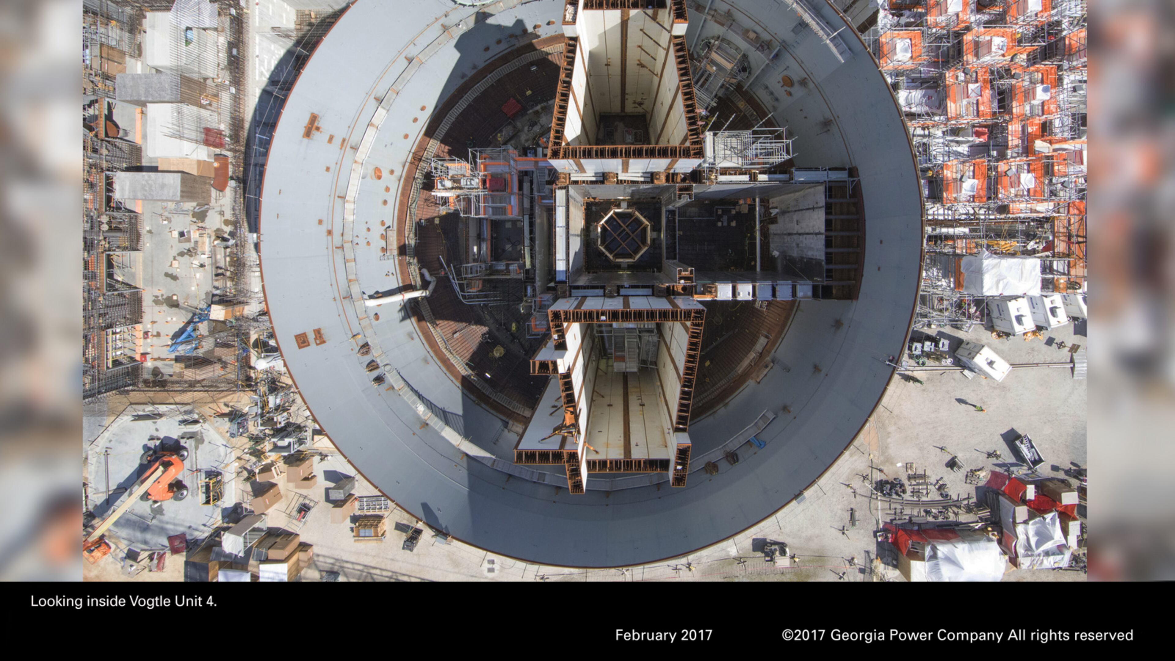 Bond rating firms said they’re reviewing the debt ratings of Georgia Power and Plant Vogtle’s other owners after the project’s key contractor, Westinghouse Electric, filed bankruptcy last week. This is an aerial view of the Unit 4 reactor under construction at the site. Photo: Georgia Power