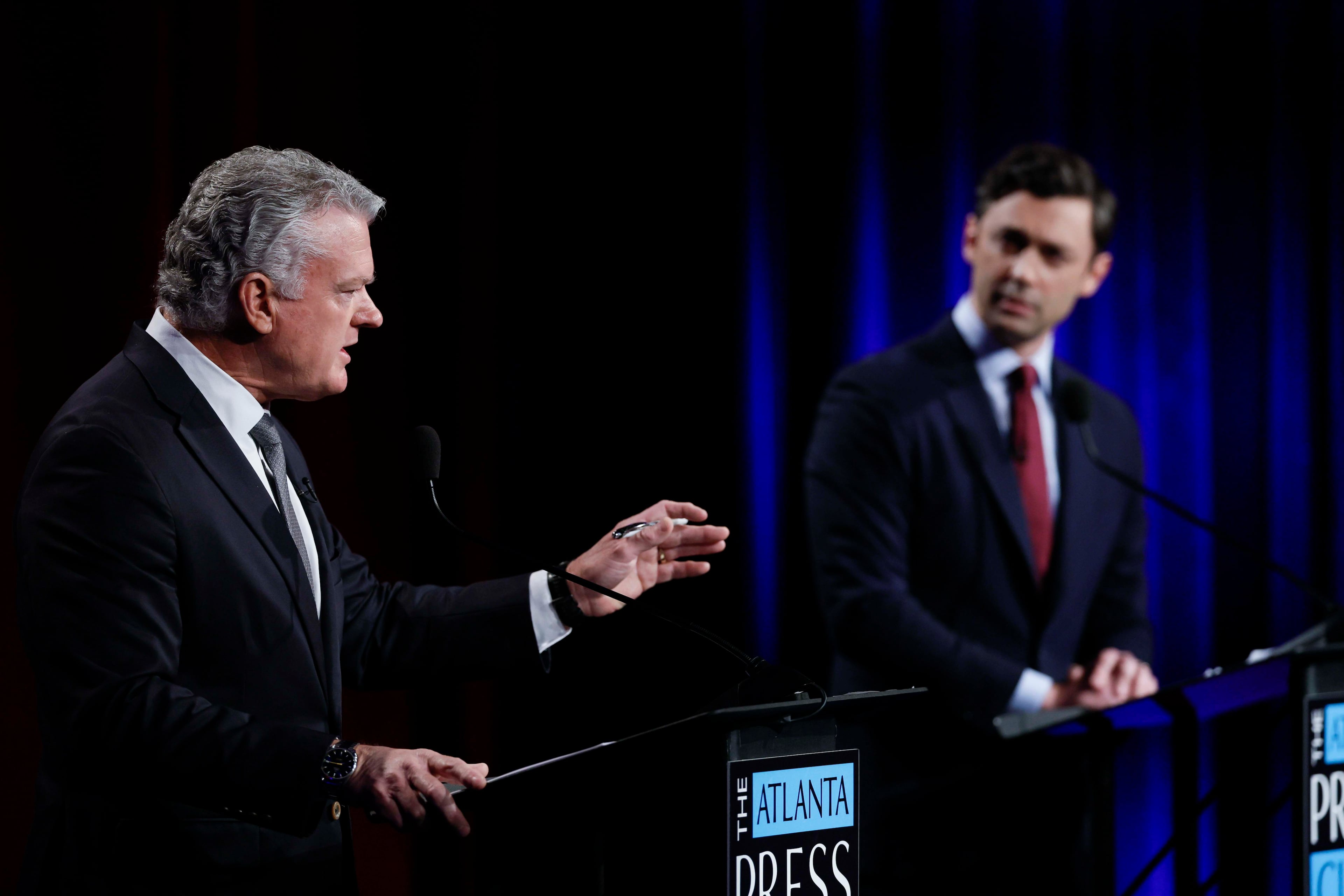 Republican U.S. Rep. Mike Collins (left) debates incumbent Democratic U.S. Sen. Jon Ossoff during the second day of the Atlanta Press Club debates at the Georgia Public Broadcasting studio in Atlanta on Tuesday. (Miguel Martinez/AJC)