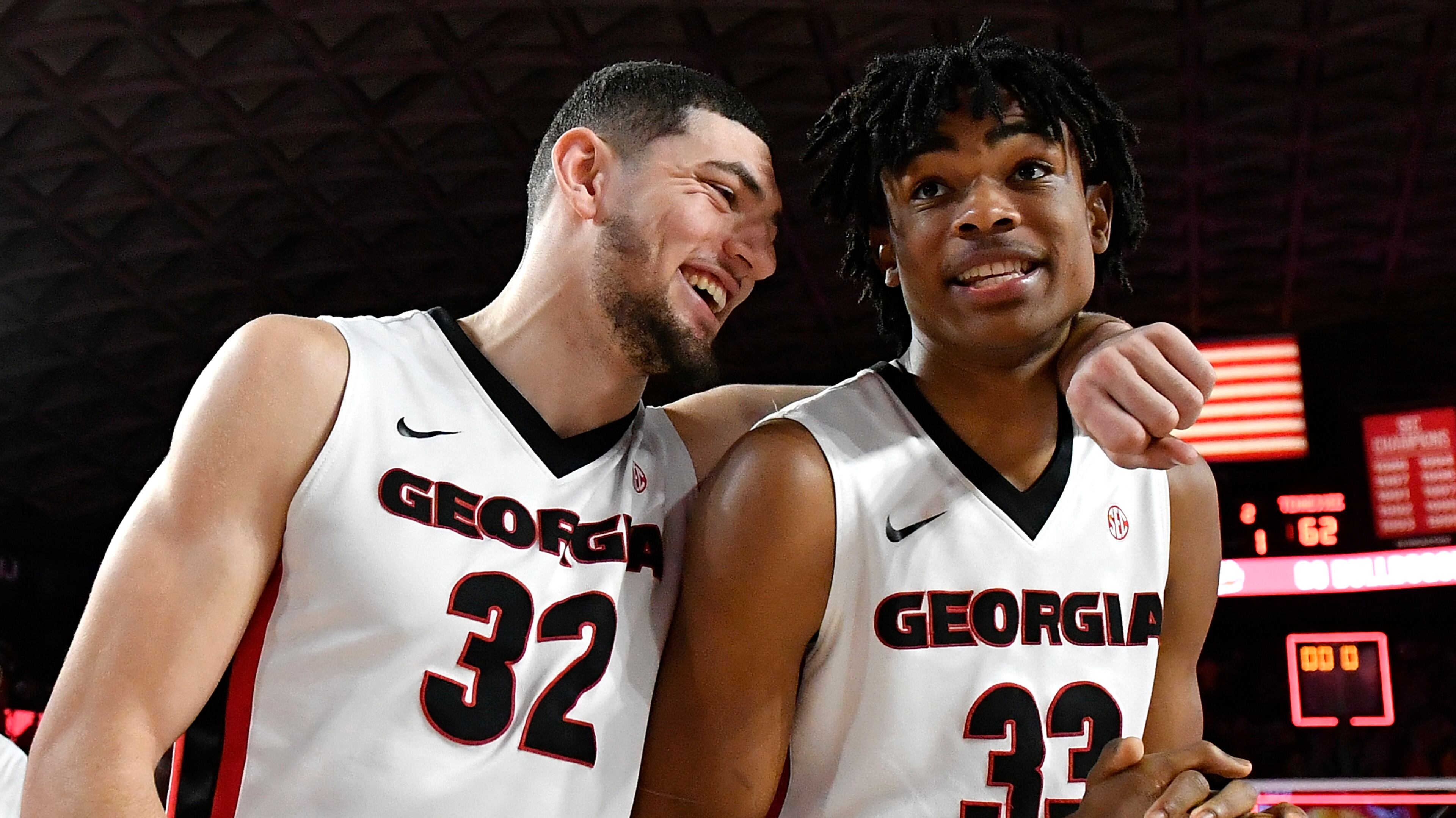 Mike Edwards (32) and Nicolas Claxton of the Georgia Bulldogs embrace as they walk off the floor following the Bulldogs' win over the Tennessee Volunteers at Stegeman Coliseum on February 17, 2018 in Athens, Georgia. (Photo by Mike Comer/Getty Images)