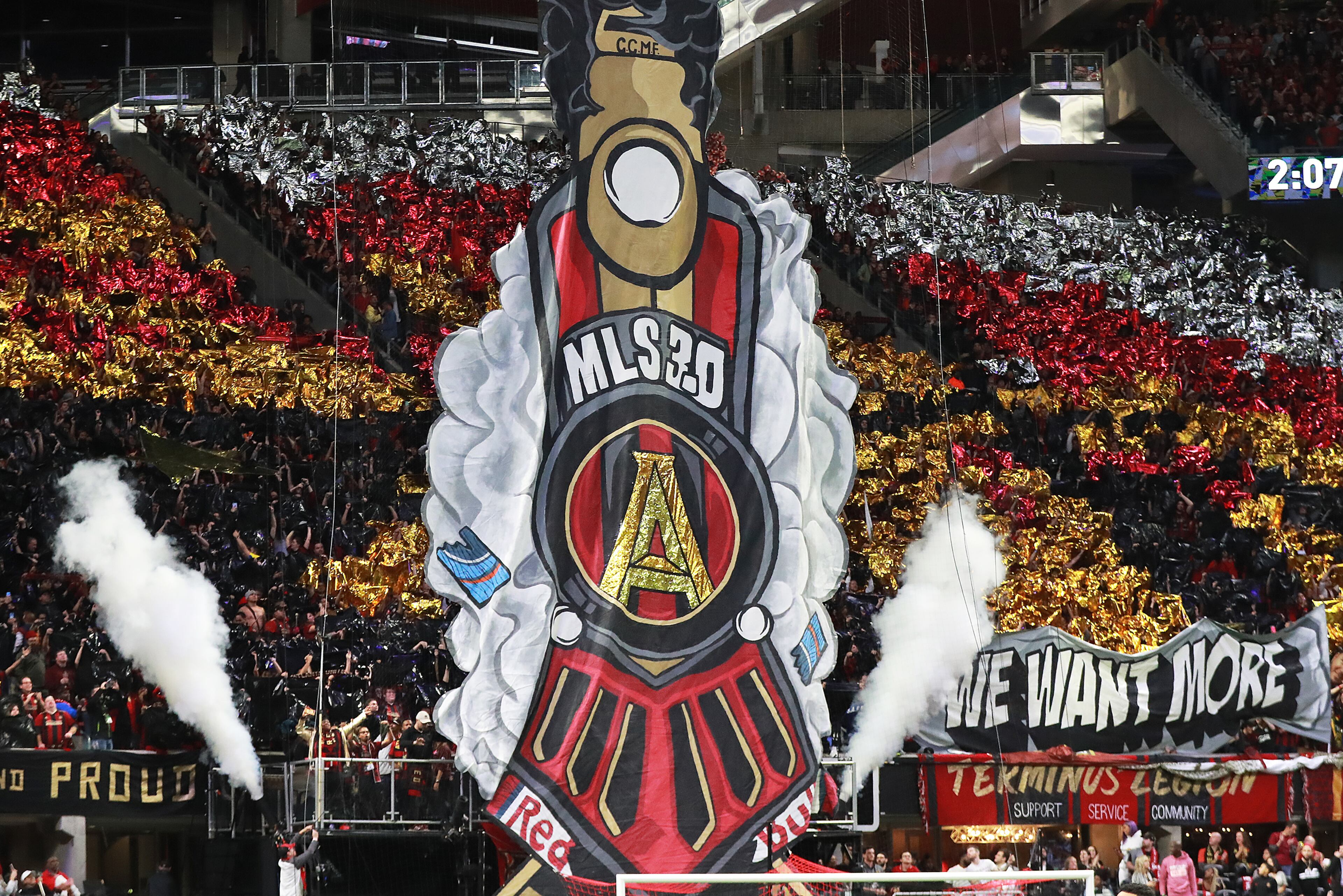 12/8/18 - Atlanta - Atlanta United fans hoist a tifo to begin the match against the Portland Timbers for the MLS Cup, the championship game of the Major League Soccer League at Mercedes-Benz Stadium in Atlanta. CURTIS COMPTON / CCOMPTON@AJC.COM