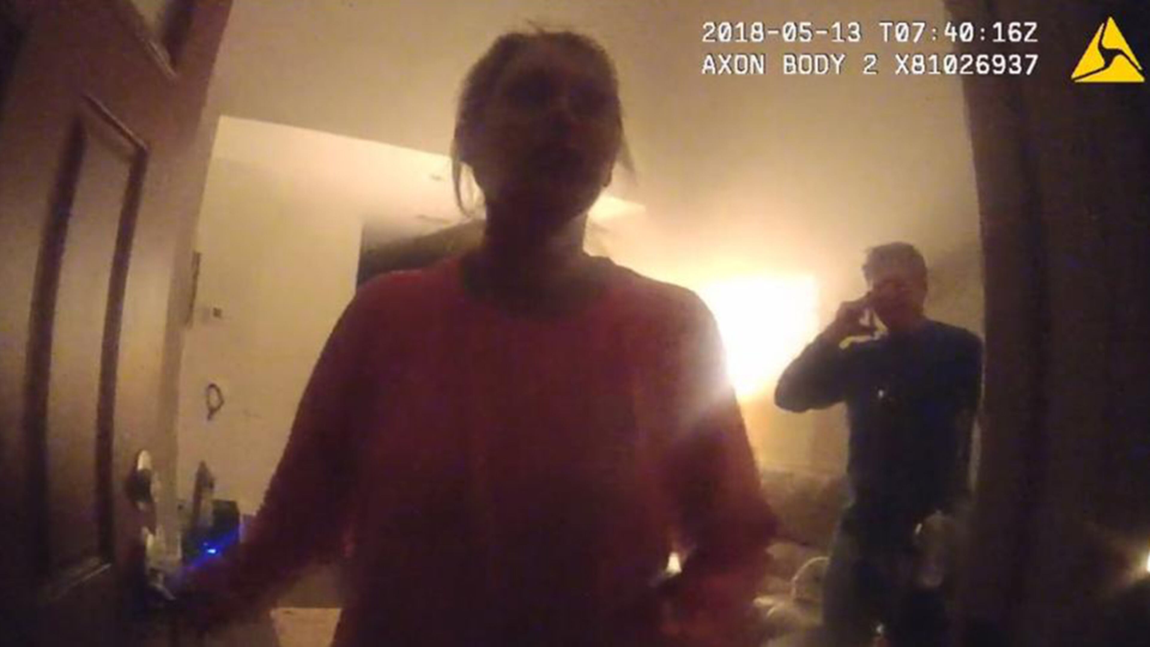 Katie Kettles Sasser at her front door the night of May 13 as officers answer a domestic incident involving her estranged husband Lt. Robert C. Sasser. This photo is from police body cam footage. The man in the background is John Hall Jr. Both Kettles Sasser and Hall were fatally shot by Lt. Sasser on June 28 at Hall’s home. Sasser then killed himself with a gunshot in a SWAT incident at his home.