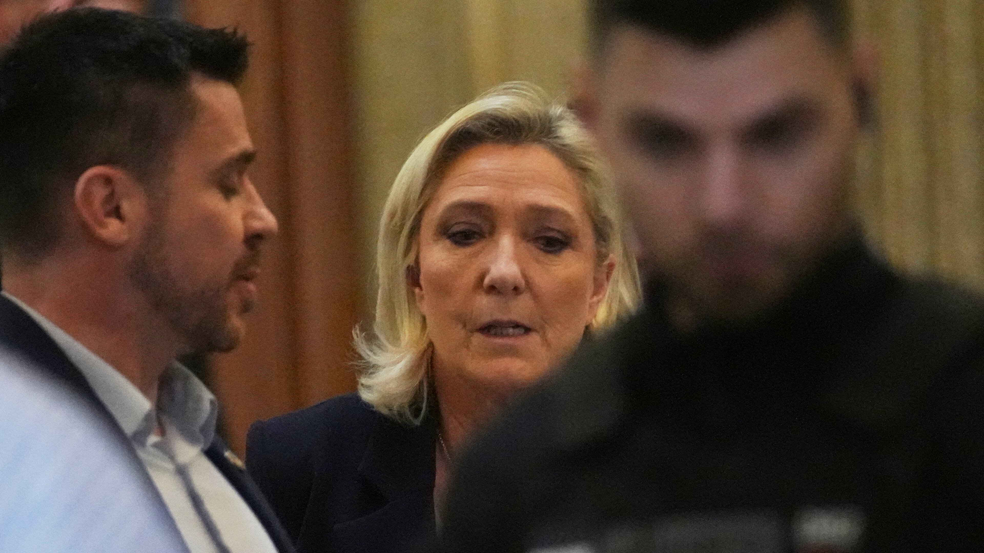 Far-right leader Marine Le Pen leaves for a break during her appeal trial after an embezzlement conviction, Tuesday, Jan. 13, 2026 in Paris. (AP Photo/Christophe Ena)