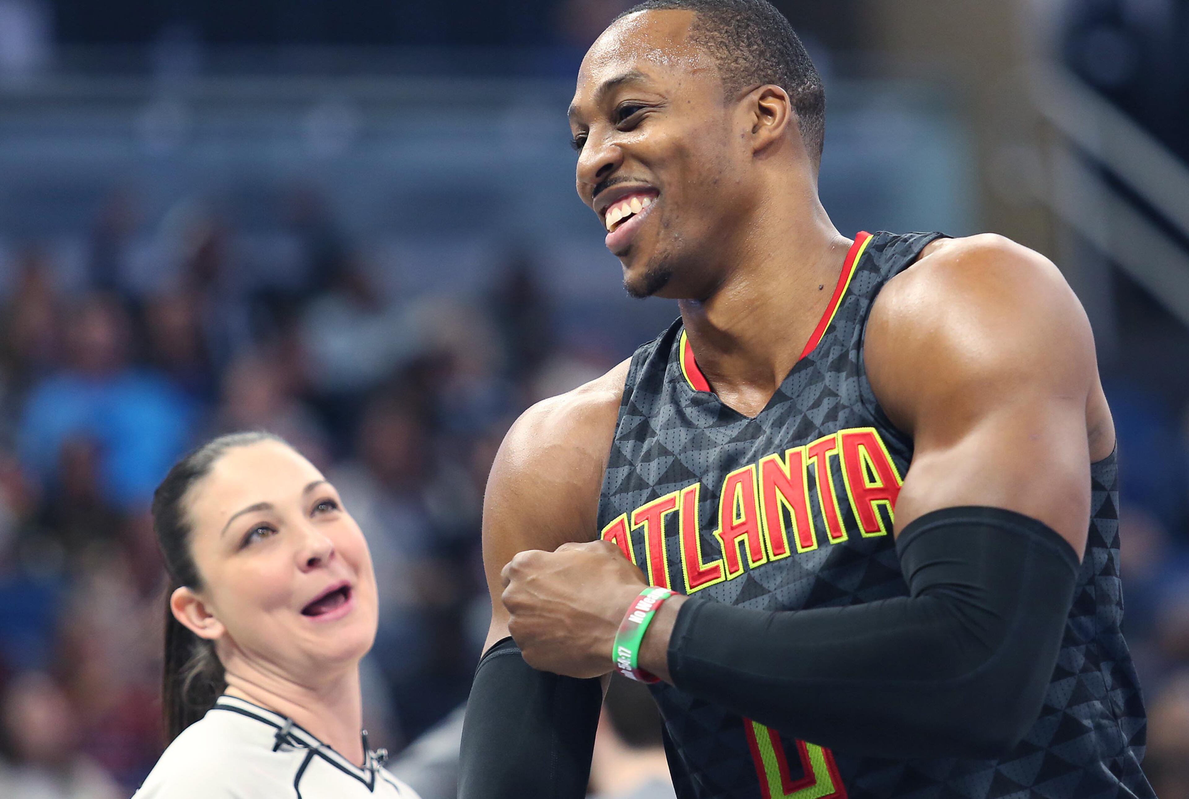 The Atlanta Hawks' Dwight Howard shares a laugh with game official Lauren Holtkamp, left, during action against the Orlando Magic at the Amway Center in Orlando, Fla., on Wednesday, Jan. 4, 2017. (Stephen M. Dowell/Orlando Sentinel/TNS)