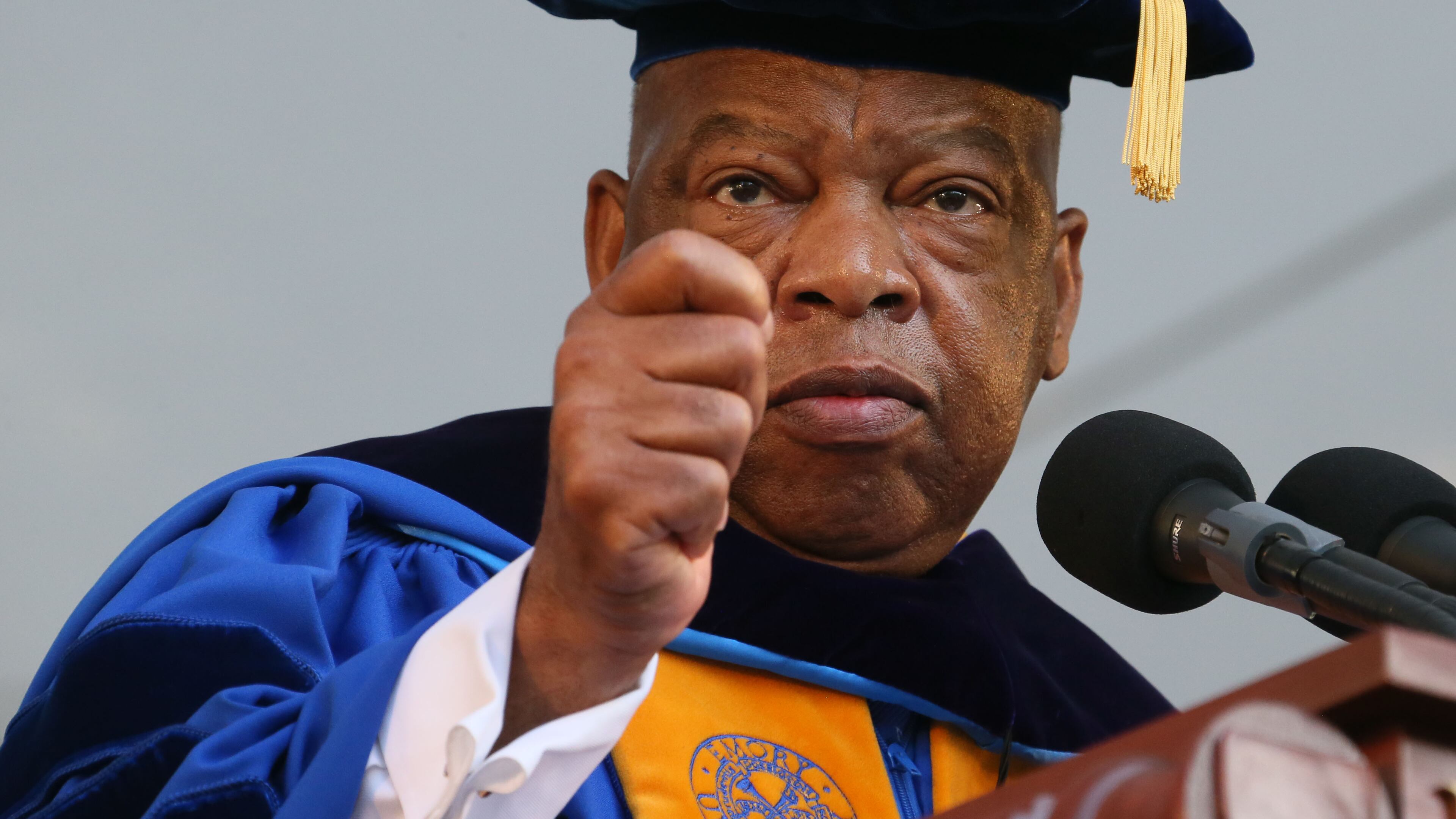 U.S. Rep. John Lewis addresses Emory University graduates in his moving 2014 commencement address, where Lewis encouraged a new generation of political activists to cause "good trouble" to bring about positive change in the country. Lewis died in July 2020. (Staff file photo by Bob Andres / AJC)