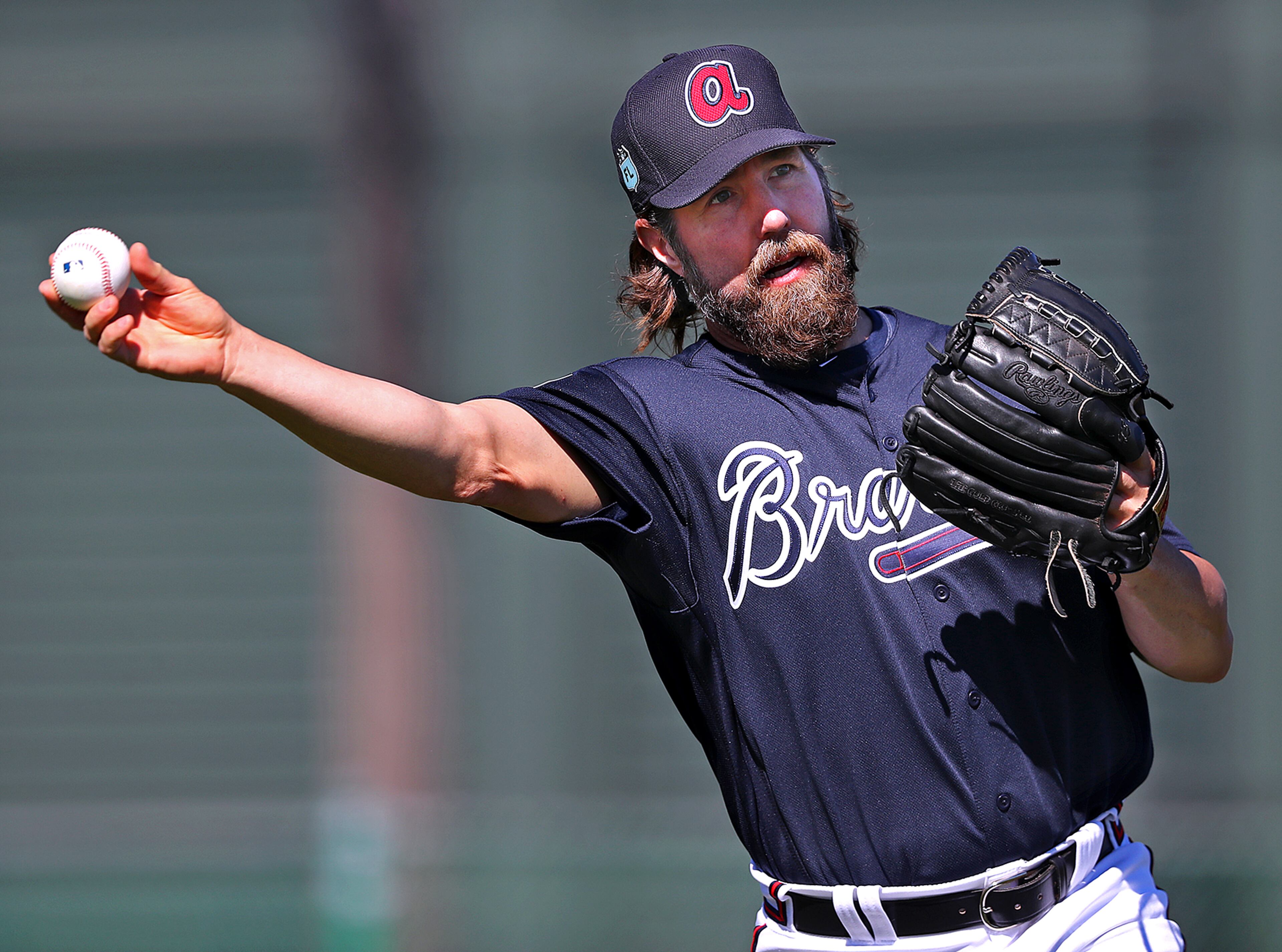 February 16, 2017, Lake Buena Vista, FL: Braves pitcher R.A. Dickey goes to first with a ground ball during spring training on Thursday Feb. 16, 2017, at the ESPN Wide World of Sports in Lake Buena Vista. Curtis Compton/ccompton@ajc.com