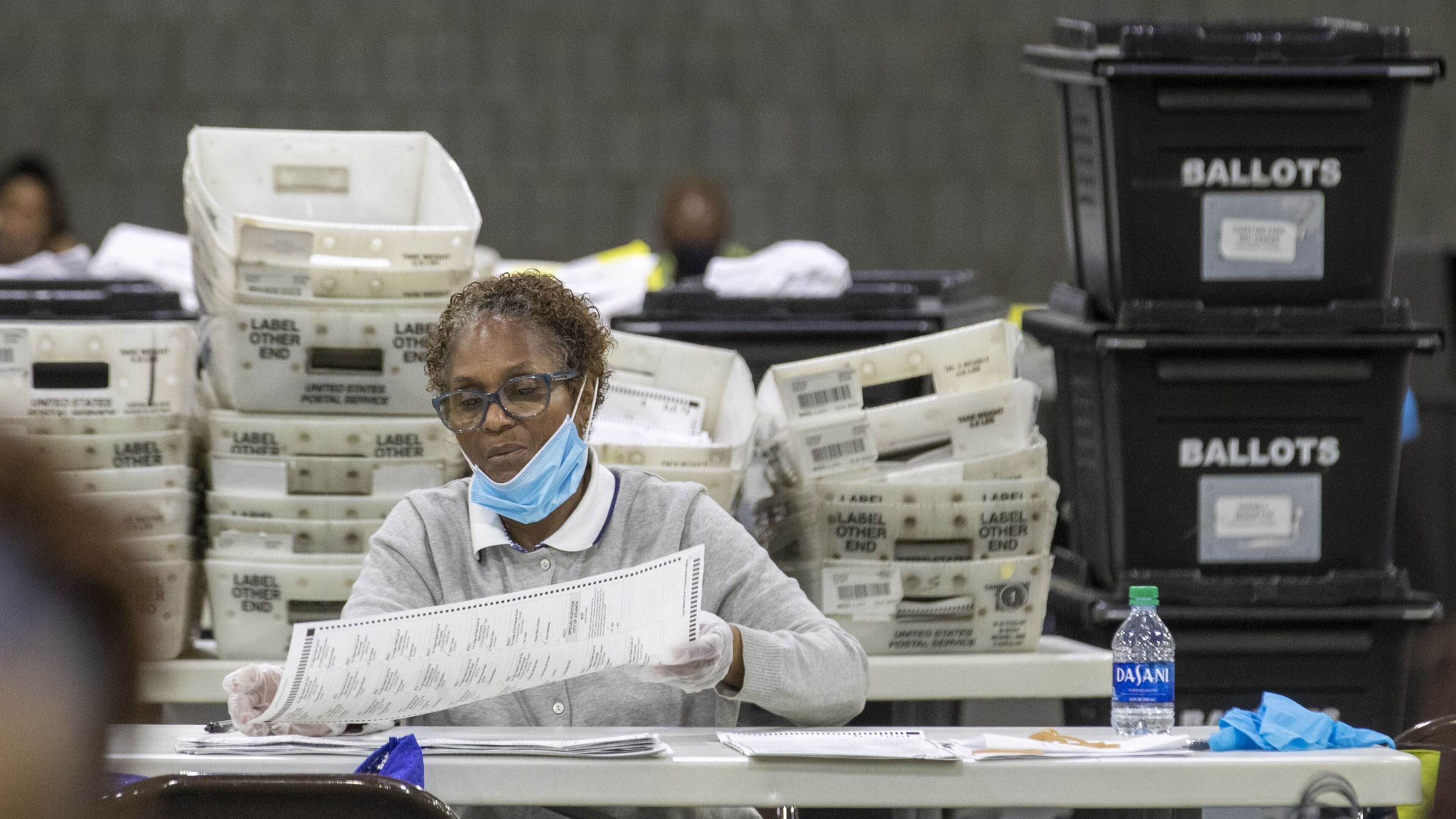 Fulton County employees continue to count mail-in ballots the day after the Georgia primary election at the Georgia World Congress Center in Atlanta. (ALYSSA POINTER / ALYSSA.POINTER@AJC.COM)