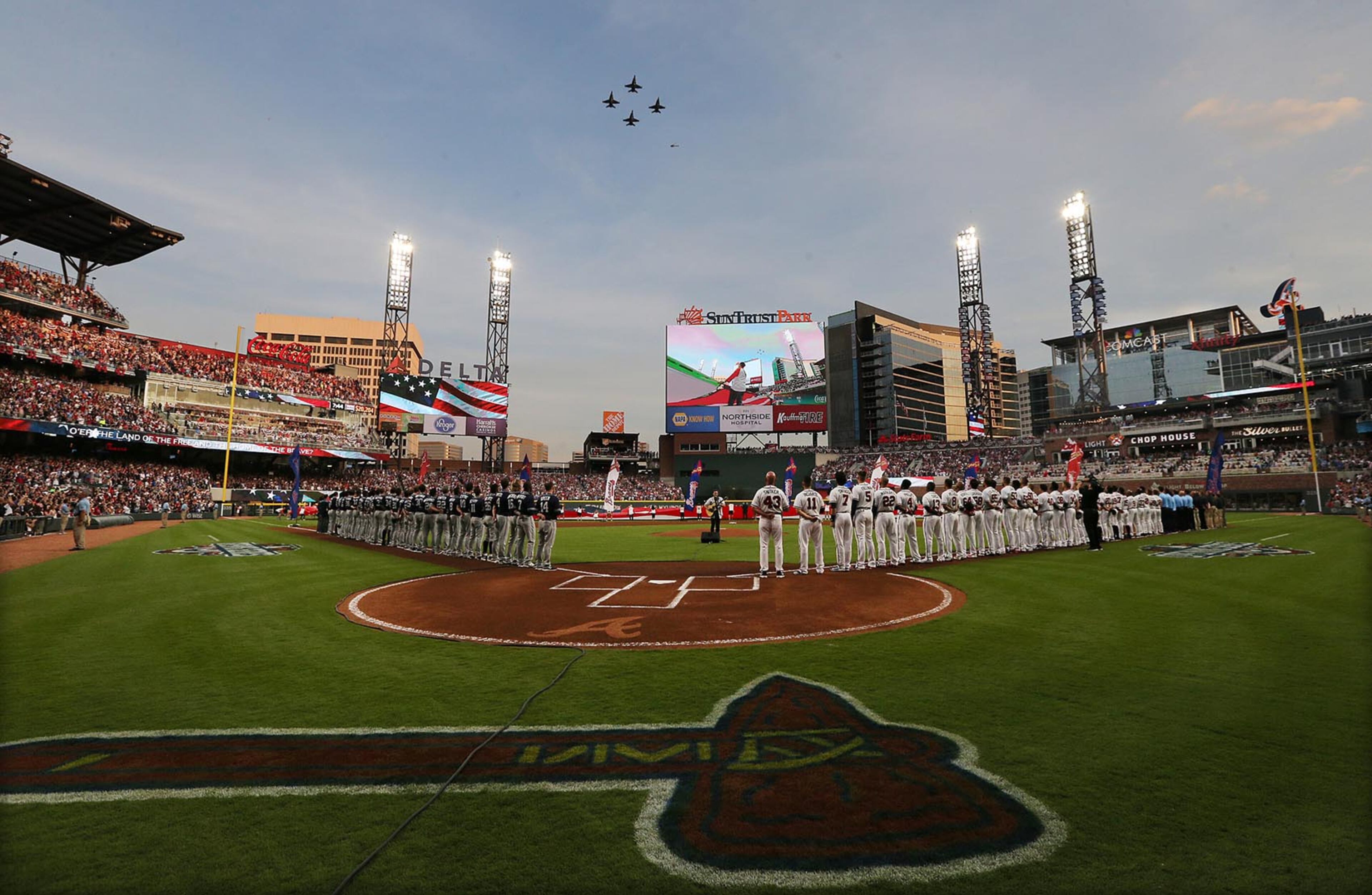 April 14, 2017, Atlanta: Fighter planes fly over during the National Anthem for the Braves home opener against the Padres at SunTrust Park on Friday, April 14, 2017, in Atlanta. Curtis Compton/ccompton@ajc.com