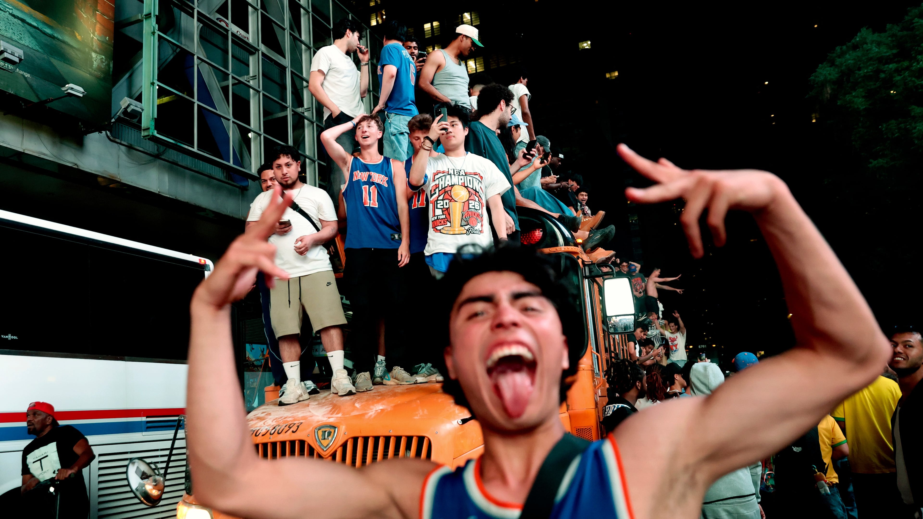New York Knicks fans celebrate their victory after Game 5 of the NBA Finals basketball series against the San Antonio Spurs, Saturday, June 13, 2026, in New York. (AP Photo/Heather Khalifa)