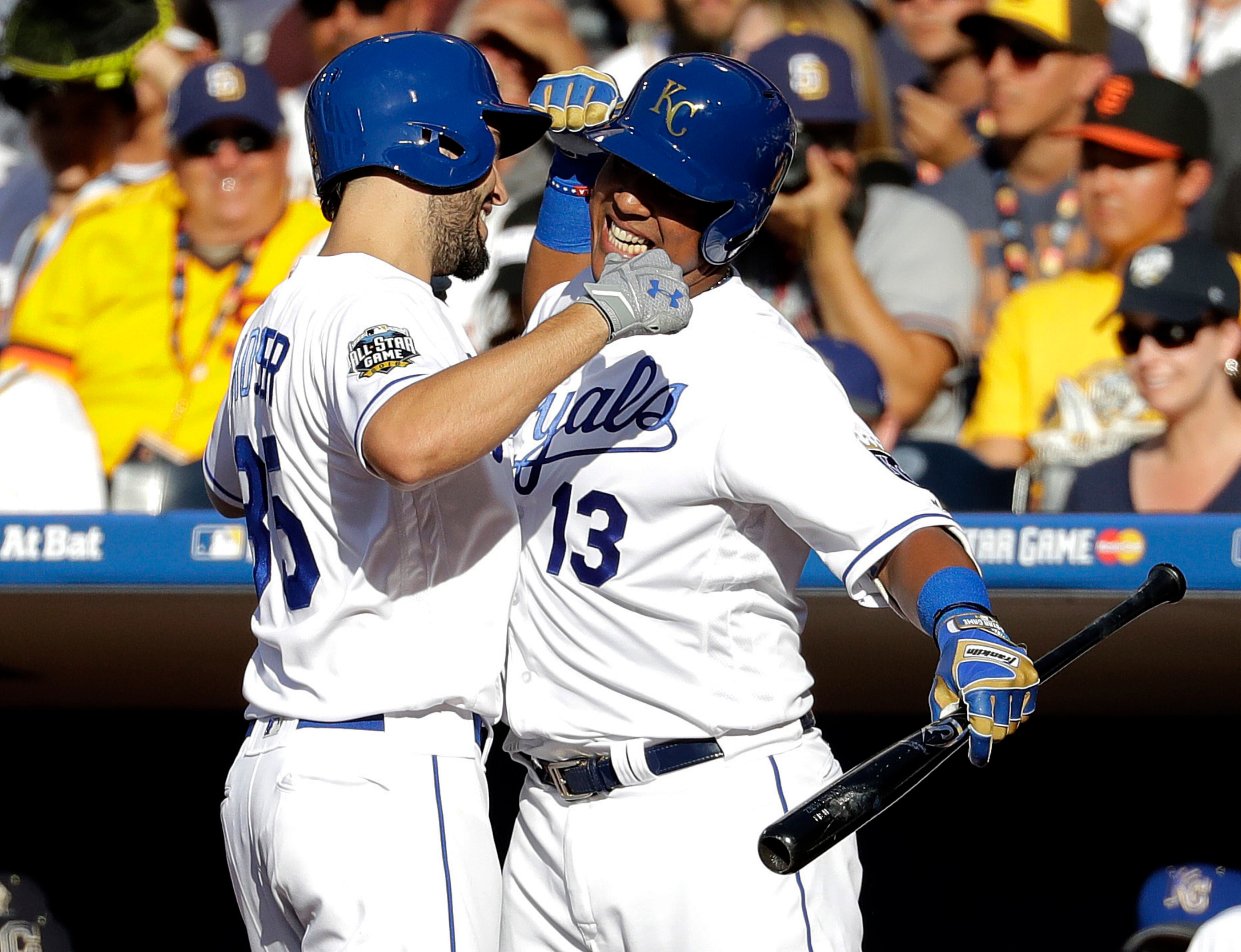 American League's Eric Hosmer, of the Kansas City Royals, left, greets teammate Salvador Perez, of the Kansas City Royals, after hitting a solo home run against the National League during the second inning of the MLB baseball All-Star Game, Tuesday, July 12, 2016, in San Diego. (AP Photo/Gregory Bull)