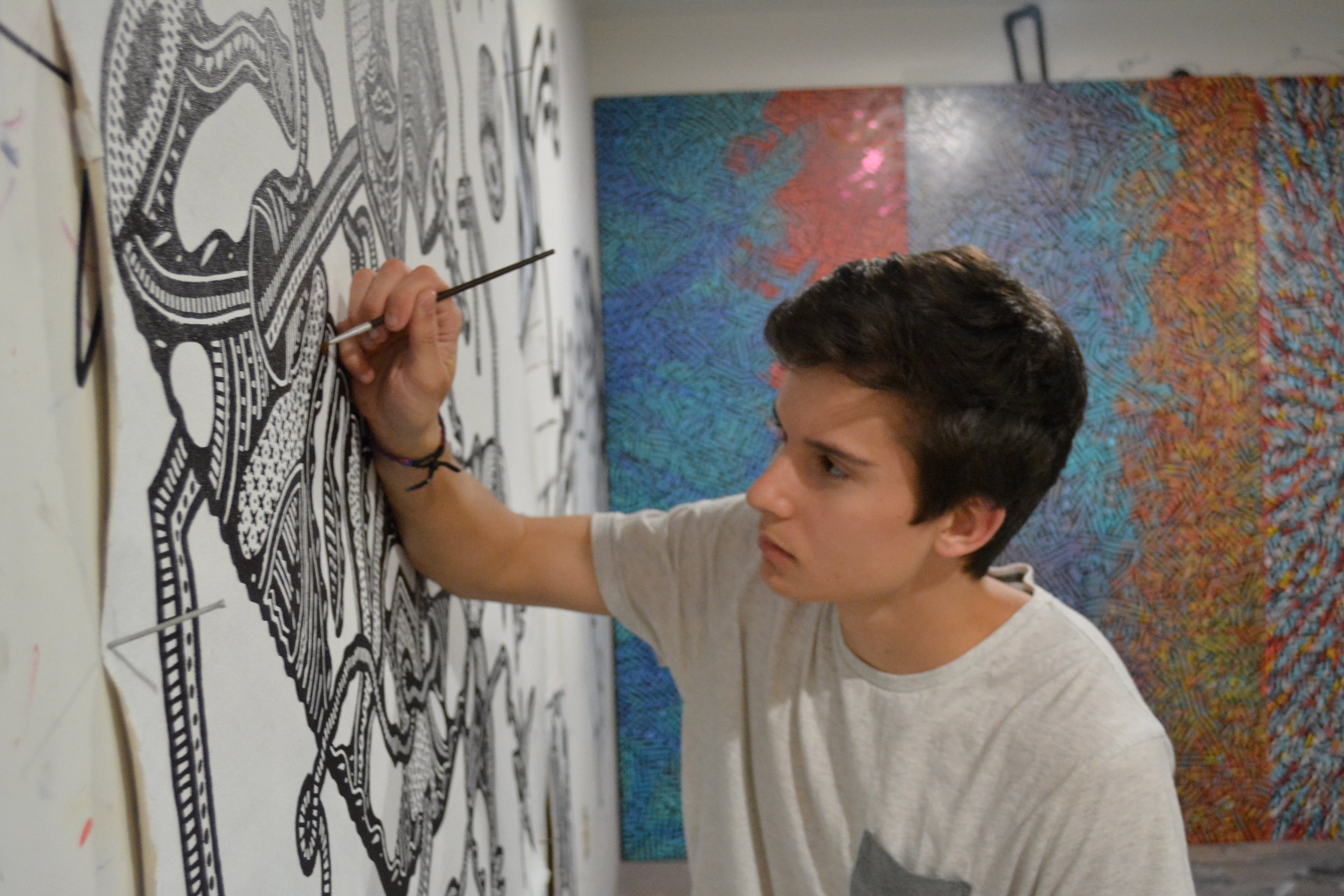 Mac Stewart,19, artist from Atlanta paints his first wall on 156 Forsyth St. Atlanta. CONTRIBUTED