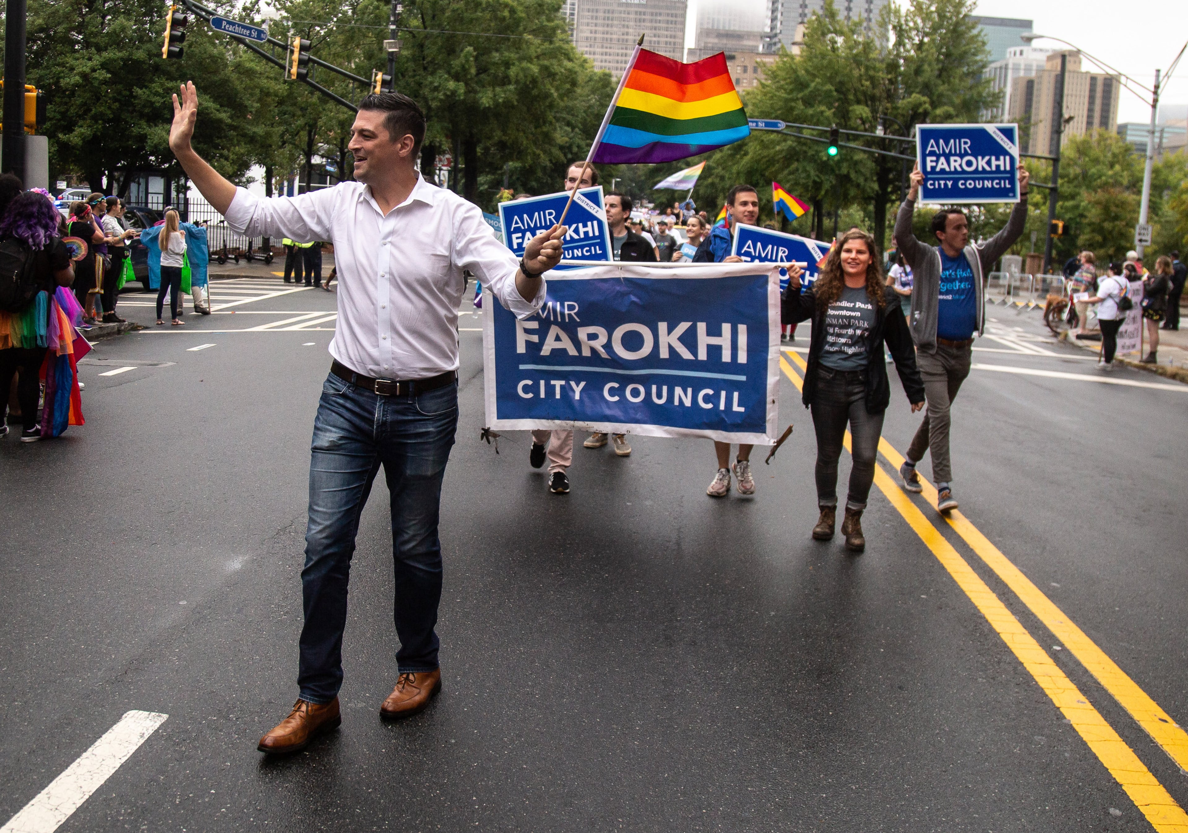 Atlanta's District 2 Representative Amir Farokhi waves to the crowd as he makes his way down Peachtree Street during the 49th annual Pride Festival and Parade in Atlanta on Sunday, Oct. 13, 2019. STEVE SCHAEFER / SPECIAL TO THE AJC